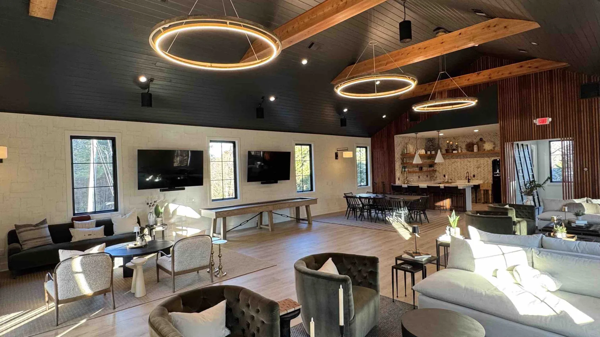 a large living room with a chandelier and a large chandelier