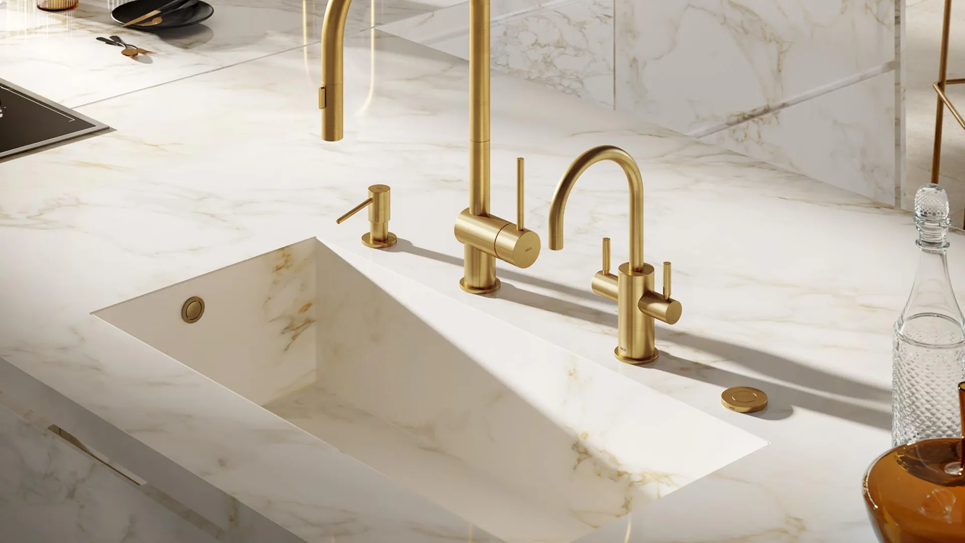 Modern kitchen sink with gold faucets and marble countertop featuring built-in sink and soap dispenser.