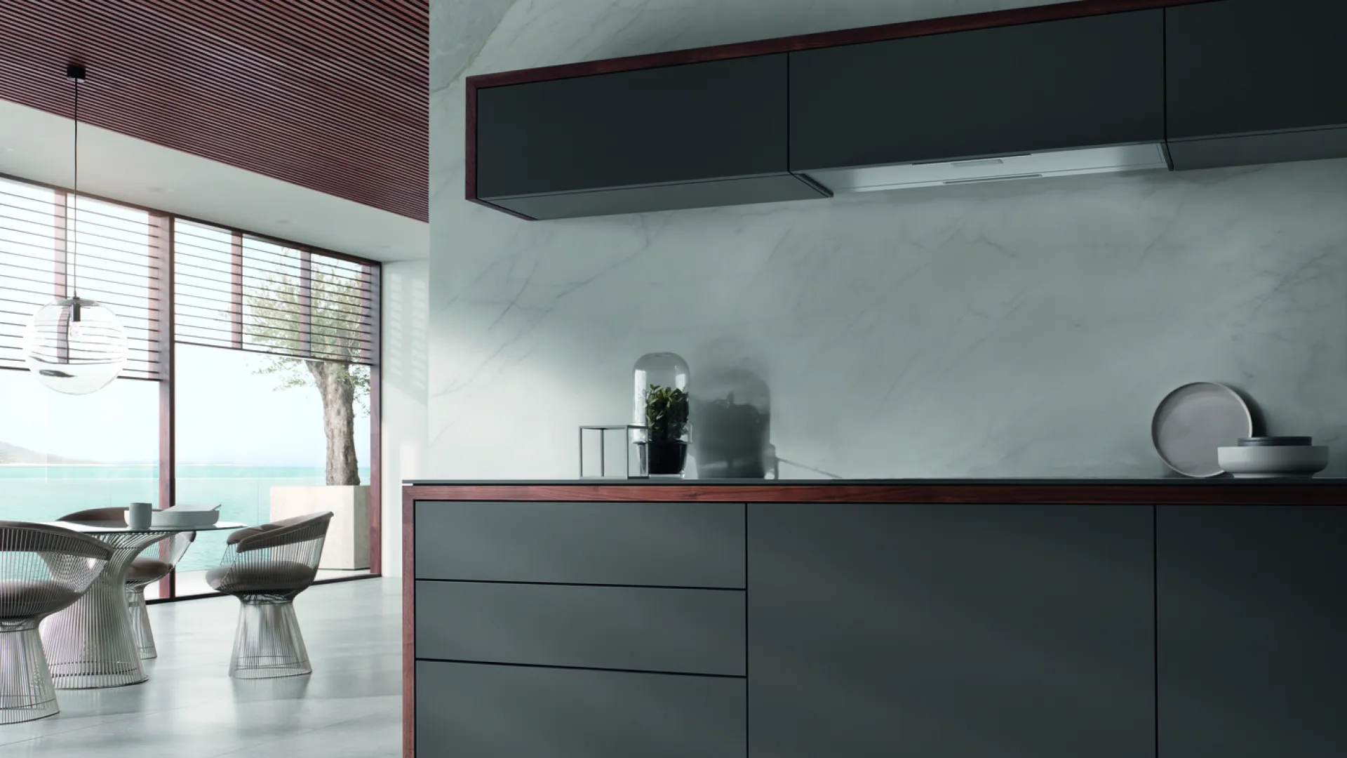 a kitchen with a bar and chairs