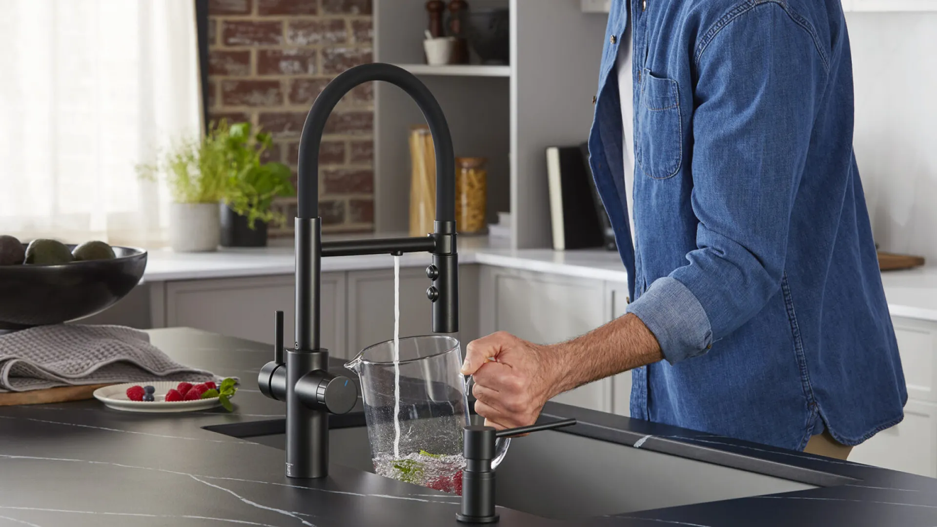 a person pouring a liquid into a glass