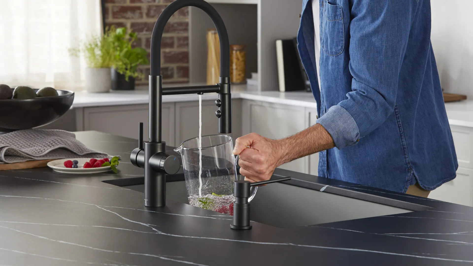 a person pouring a liquid into a glass