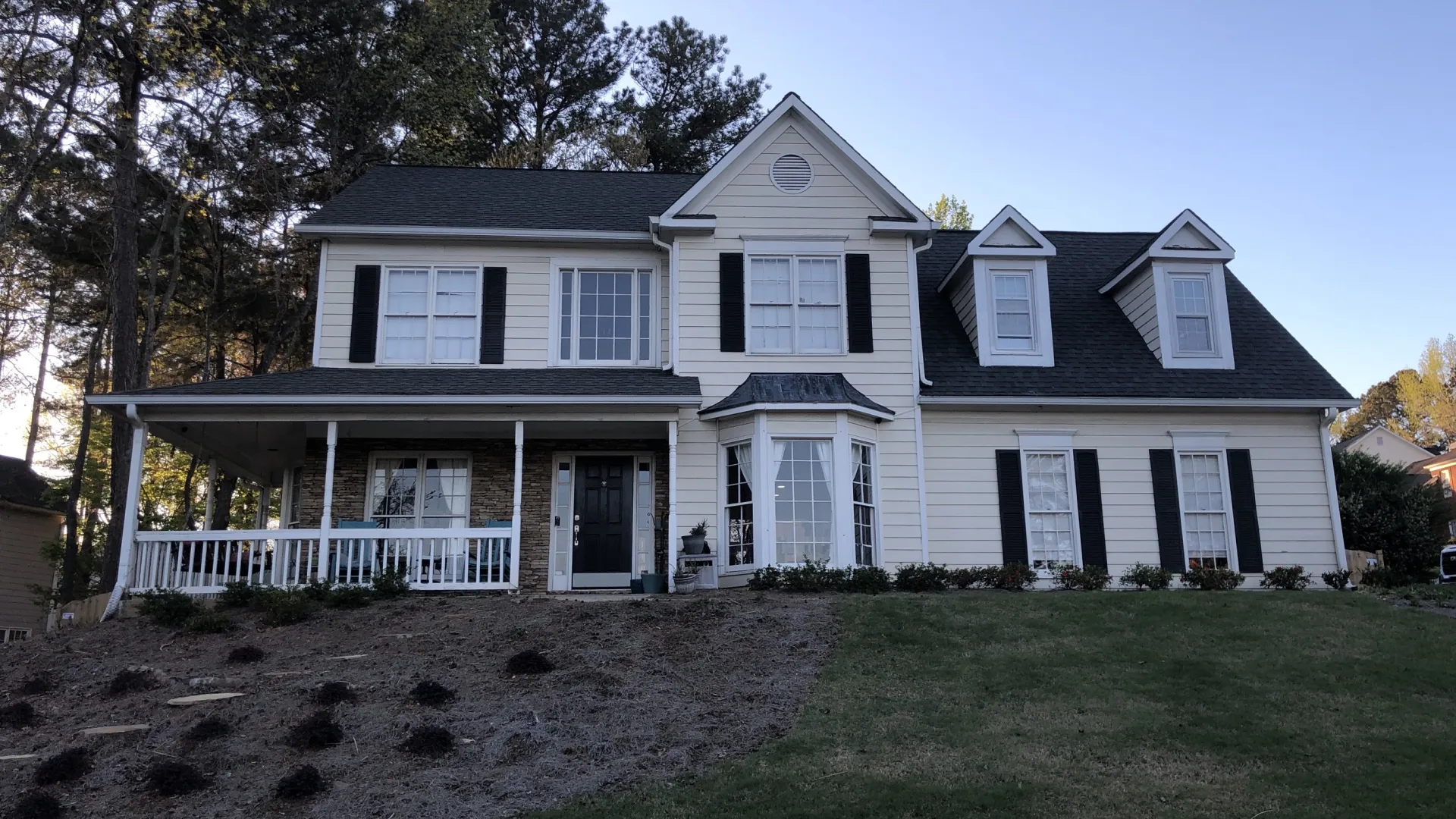 a large house with a lawn in front of it