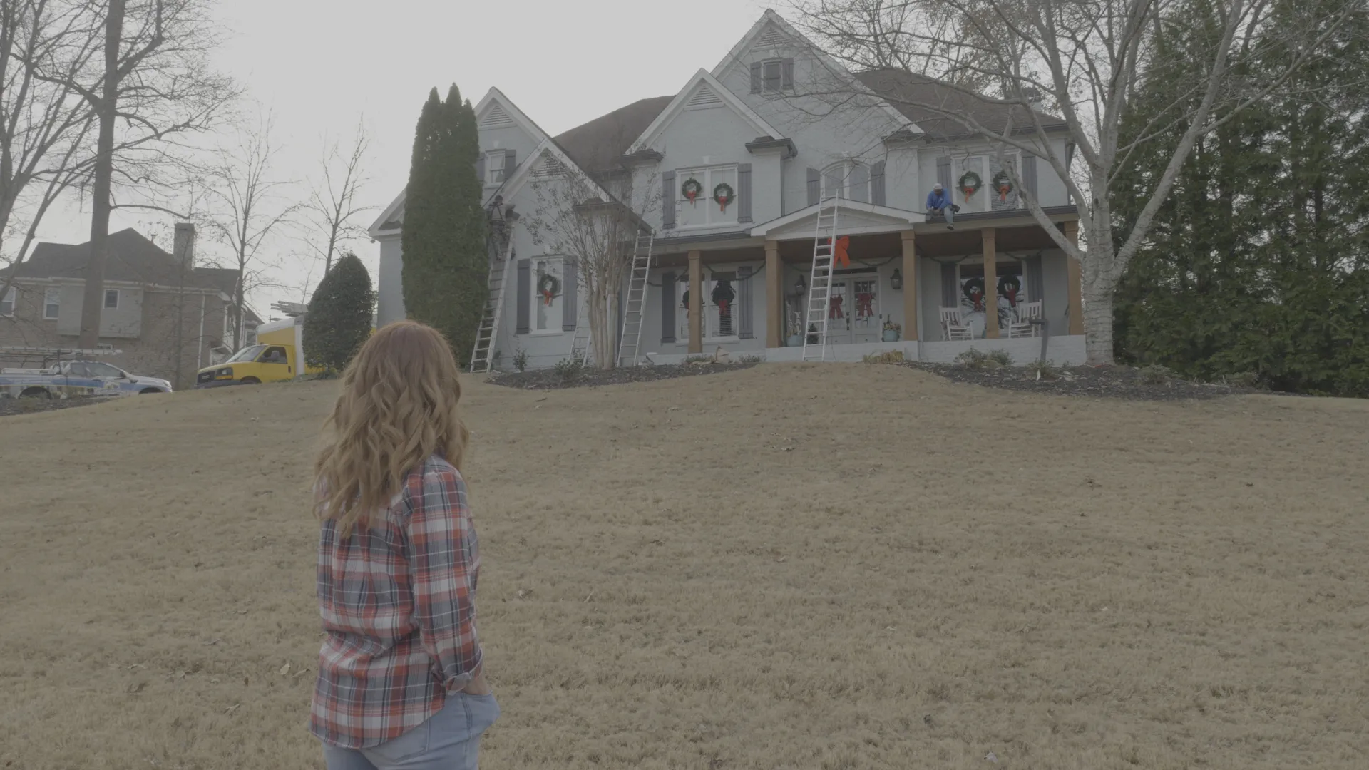 a man walking in front of a house