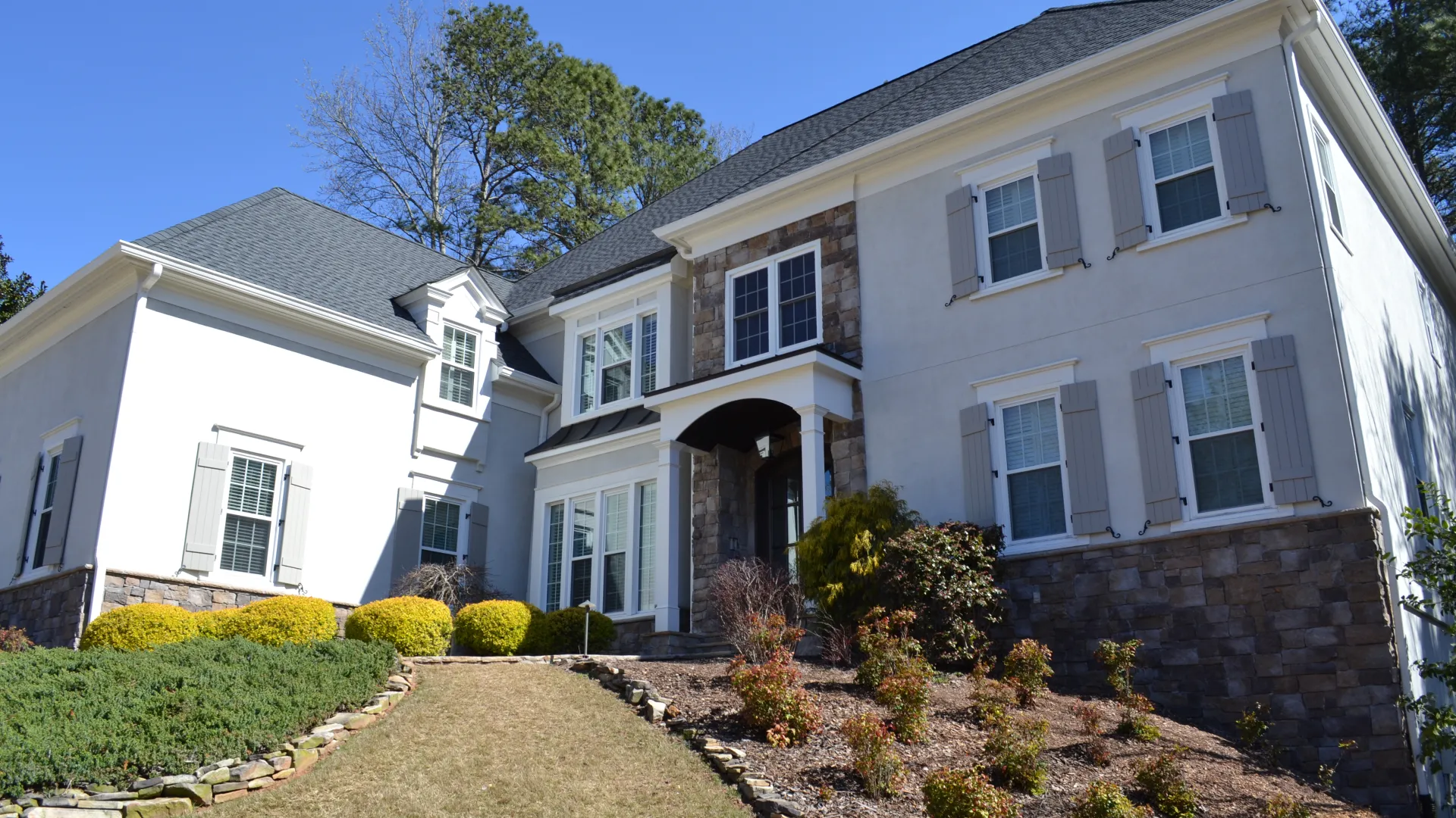 a house with a brick driveway