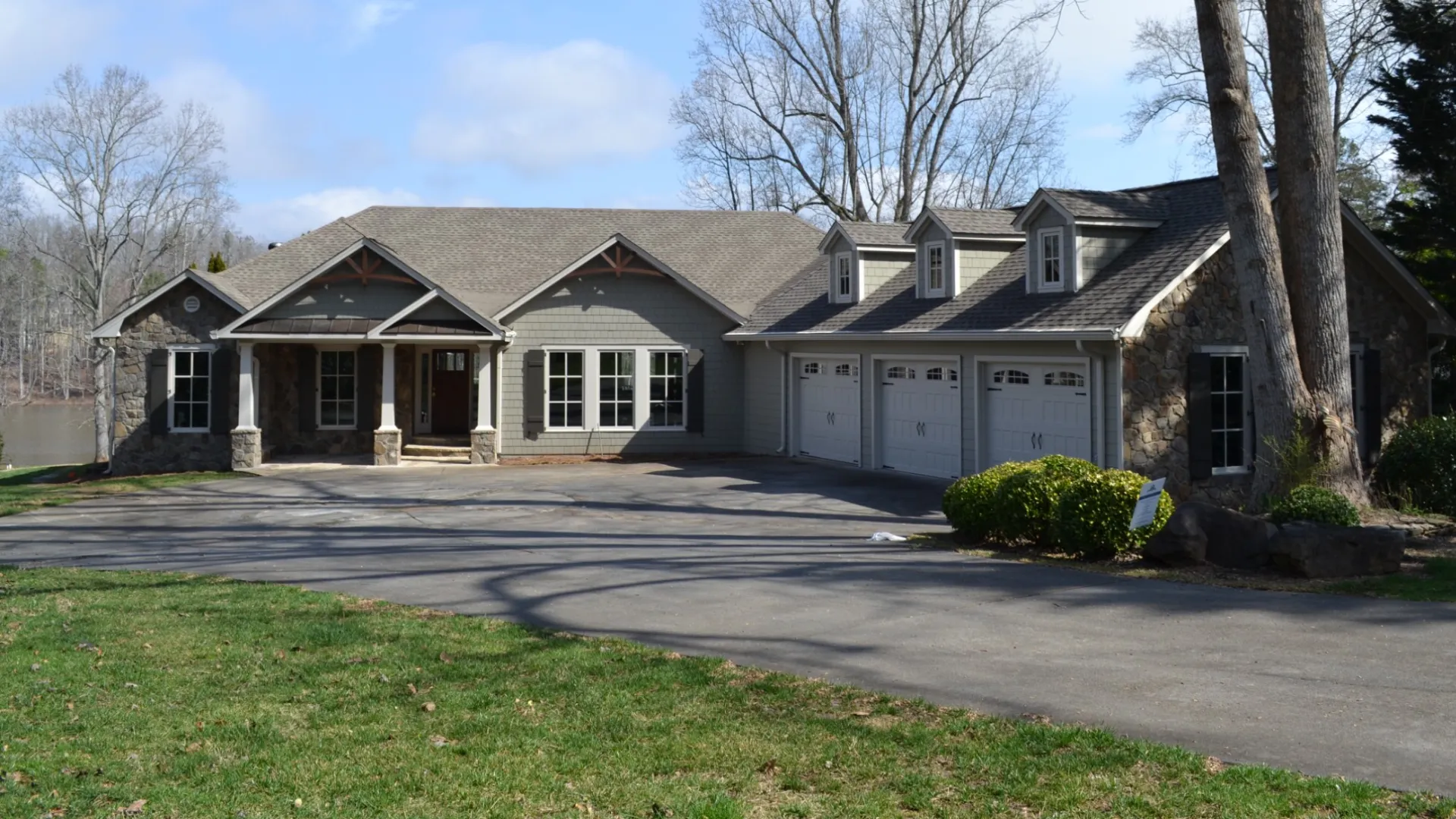 a house with trees and grass