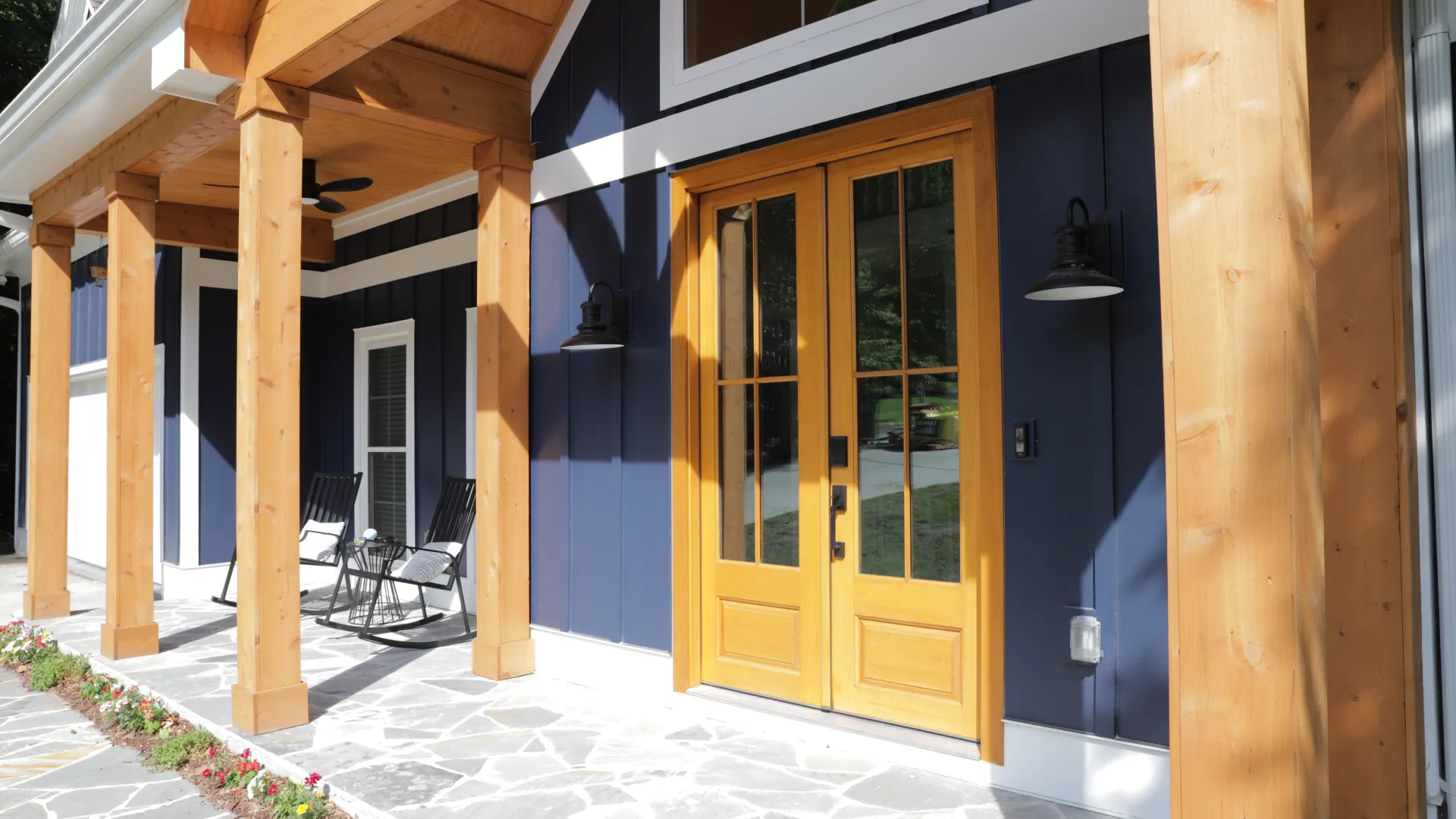 a house with a patio and a wood door