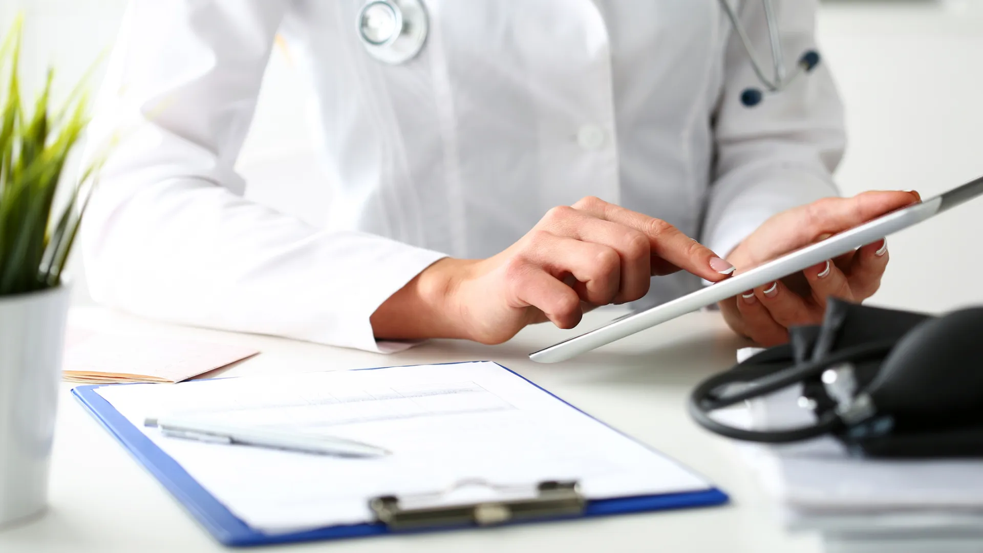 a doctor writing on a piece of paper