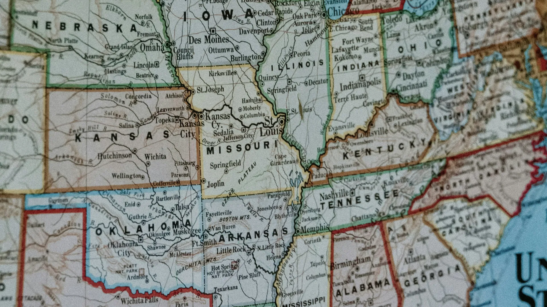 Close-up of a vintage map showing central and southern US states with state borders and major cities.