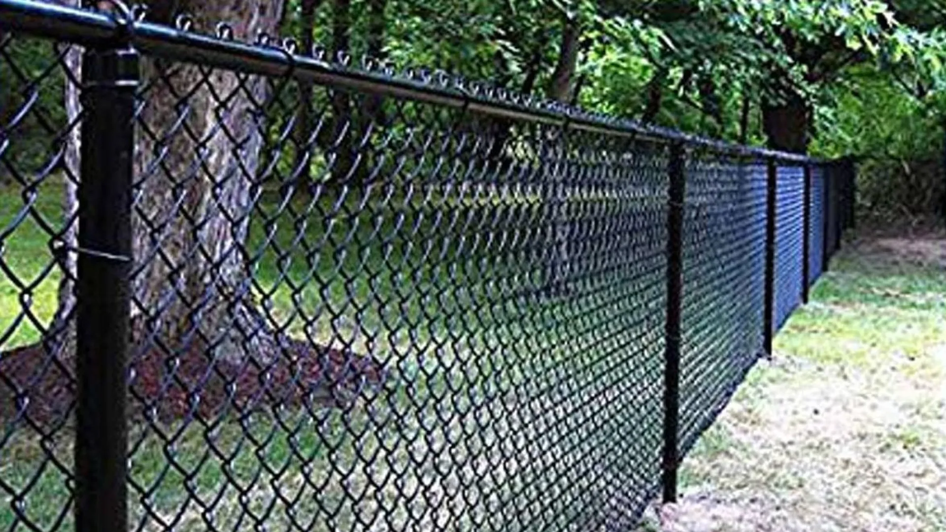 a black fence with a metal gate