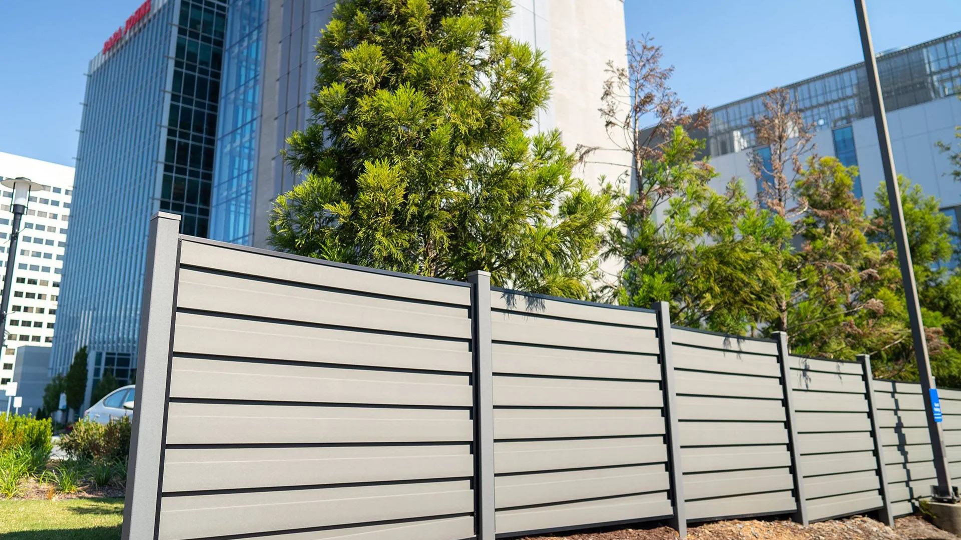 a white fence in front of a building