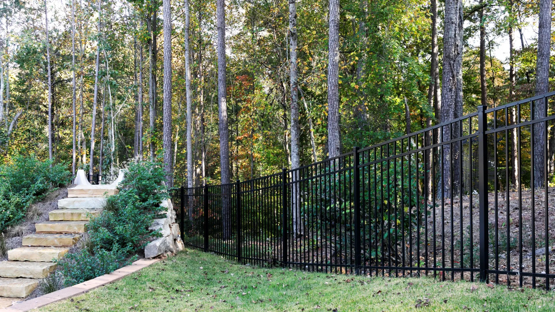 a gate in a wooded area