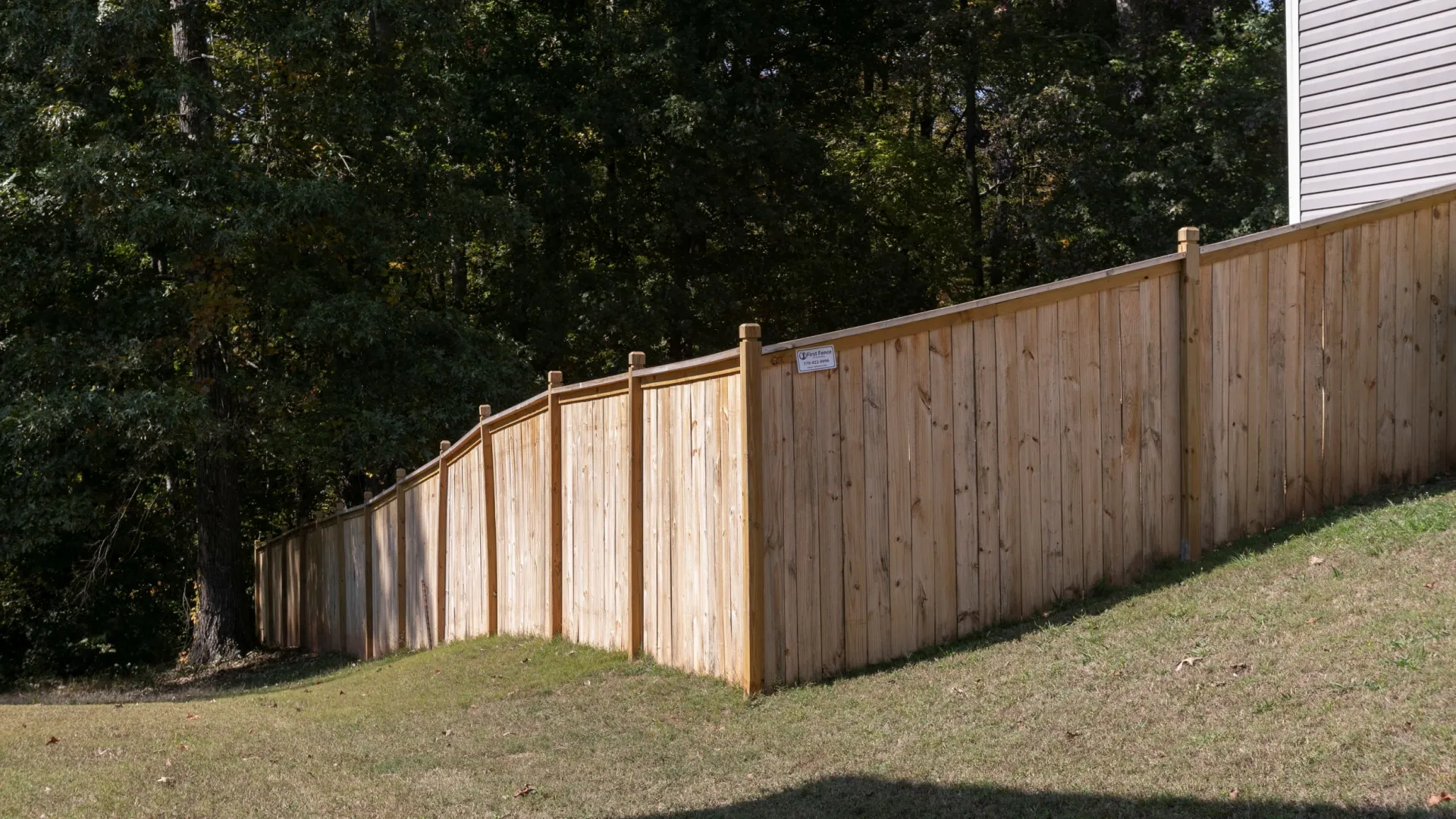 a wooden fence in a yard