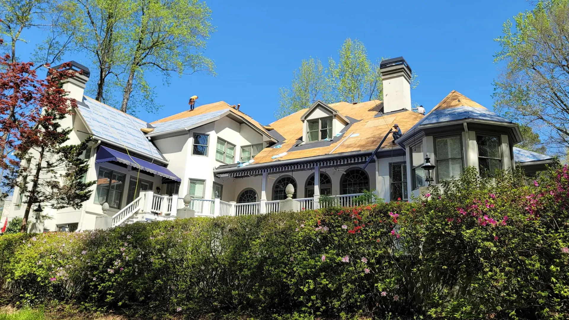 a large house with a garden in front of it