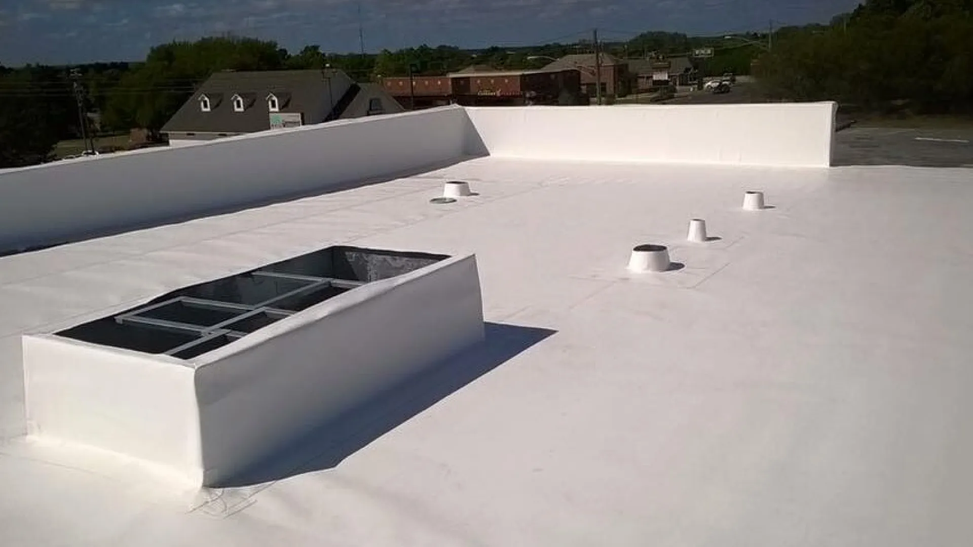 a white roof with a solar panel