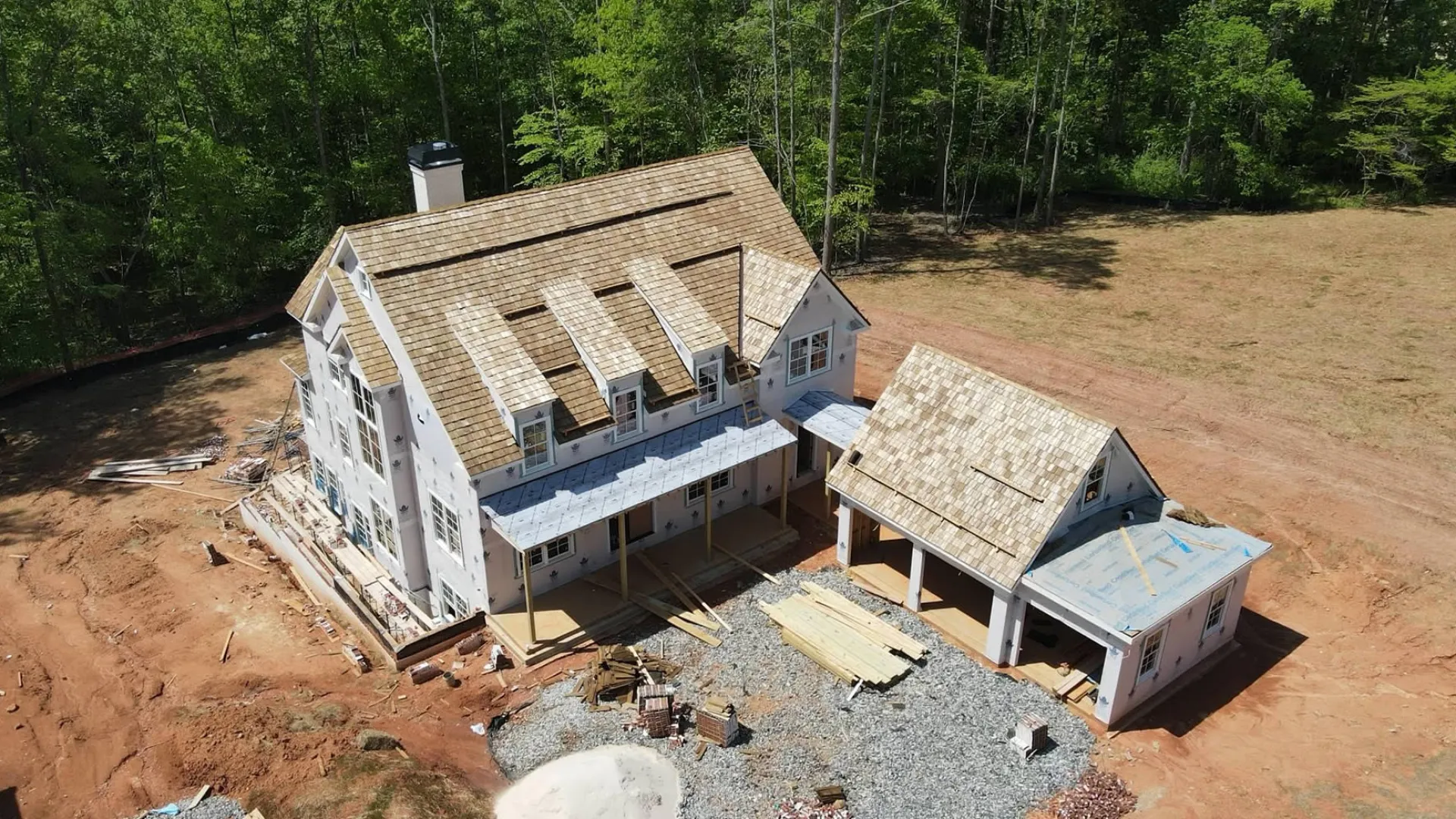 a house being built in a dirt field