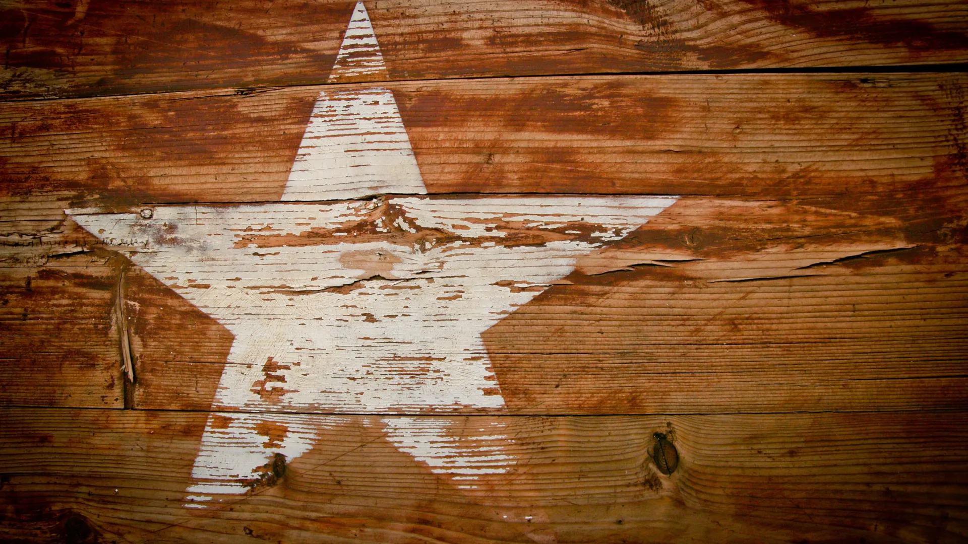 a wooden floor with a white triangle