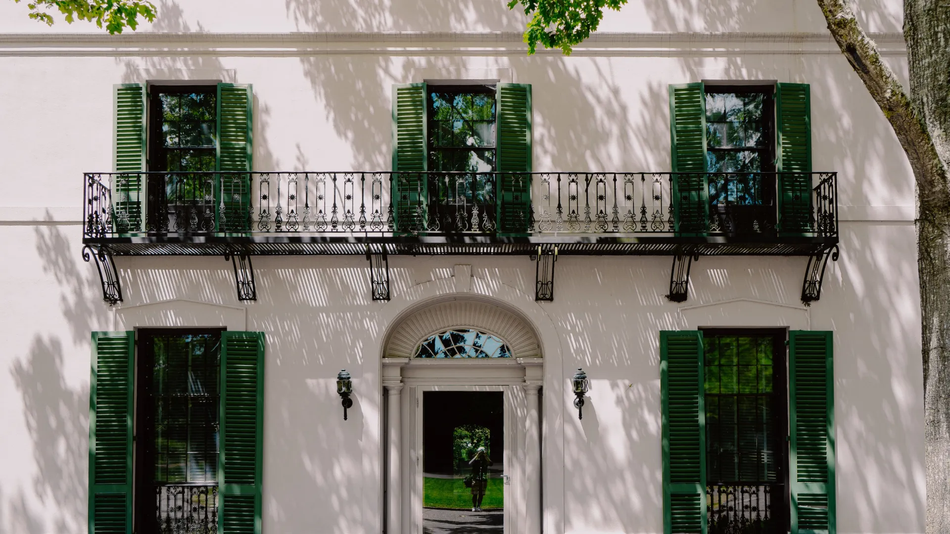 a building with green shutters