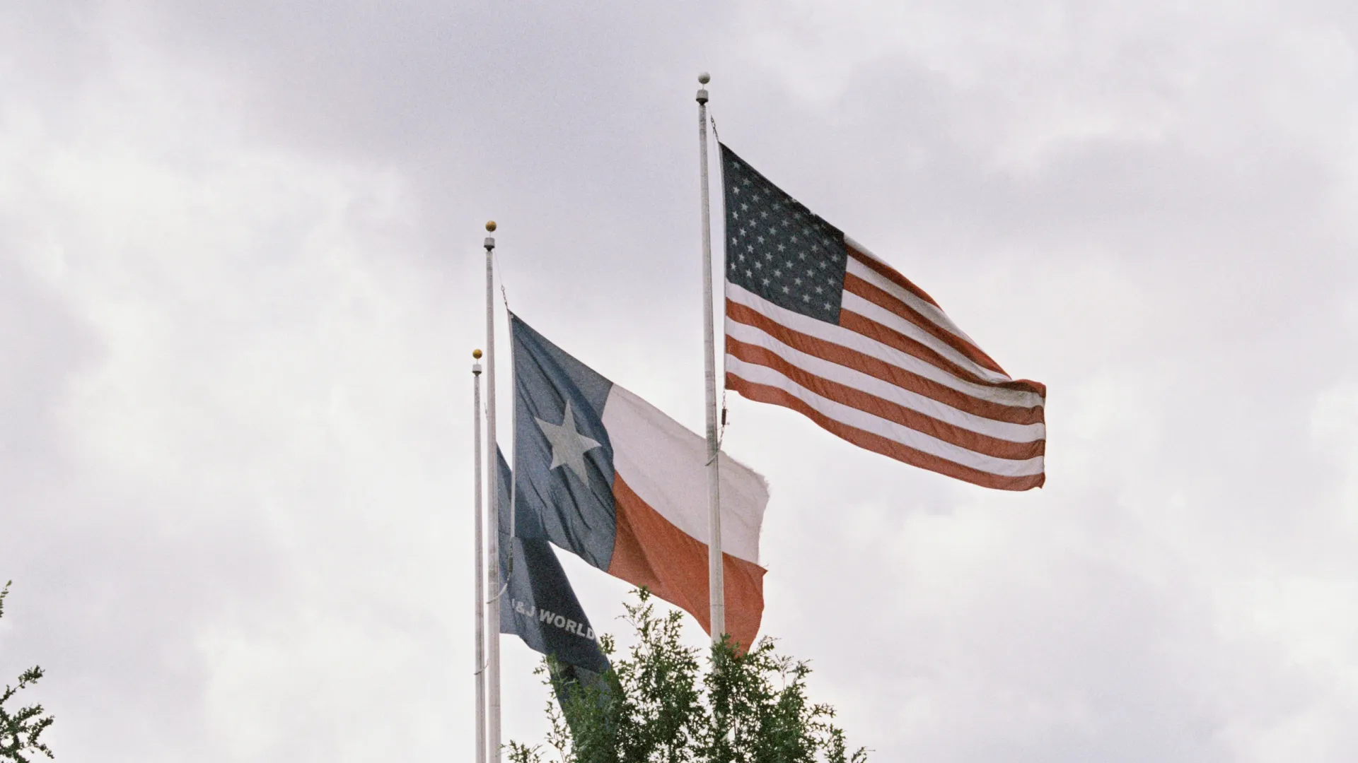 a few flags flying in the air