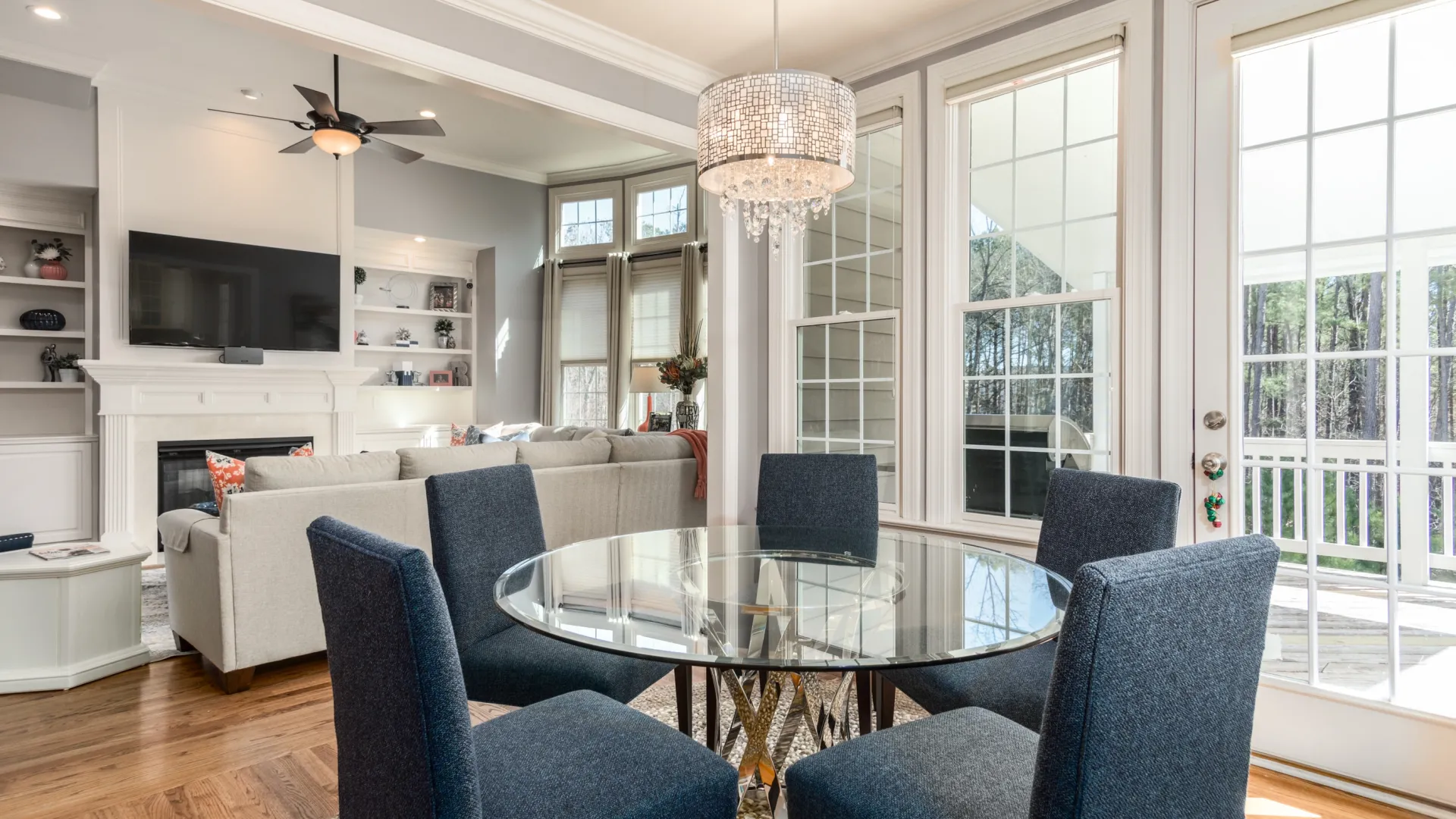 a living room with a table and chairs