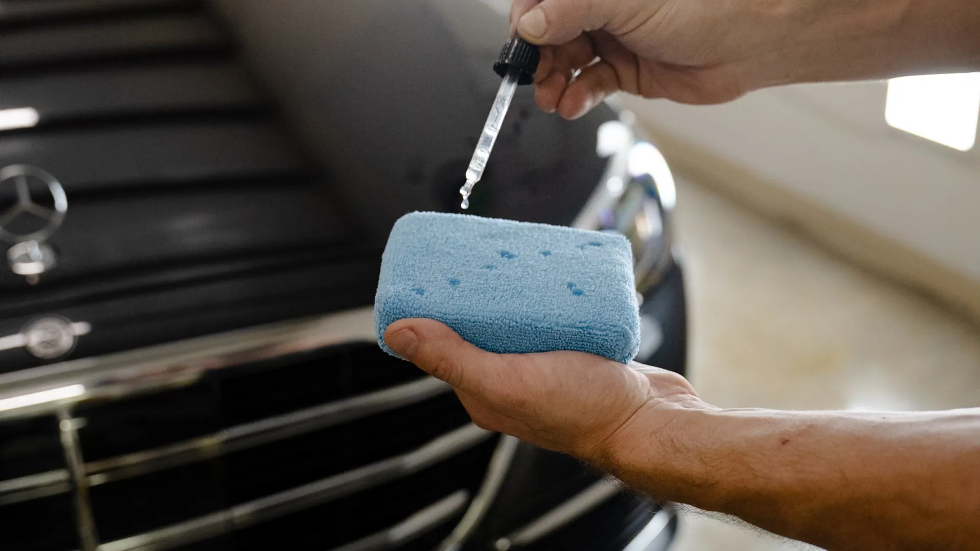Sleek blue Ferrari design with dual white racing stripes against a dark background.