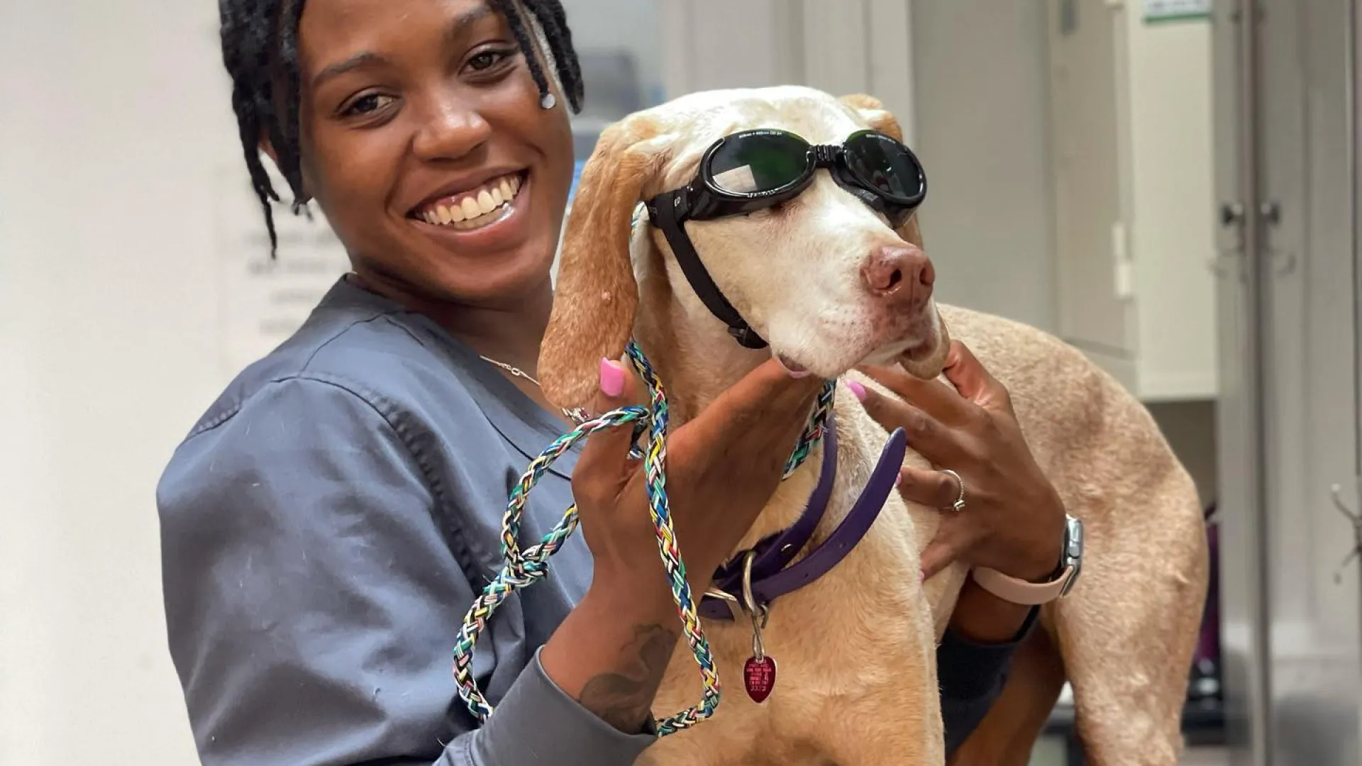 a woman holding a dog