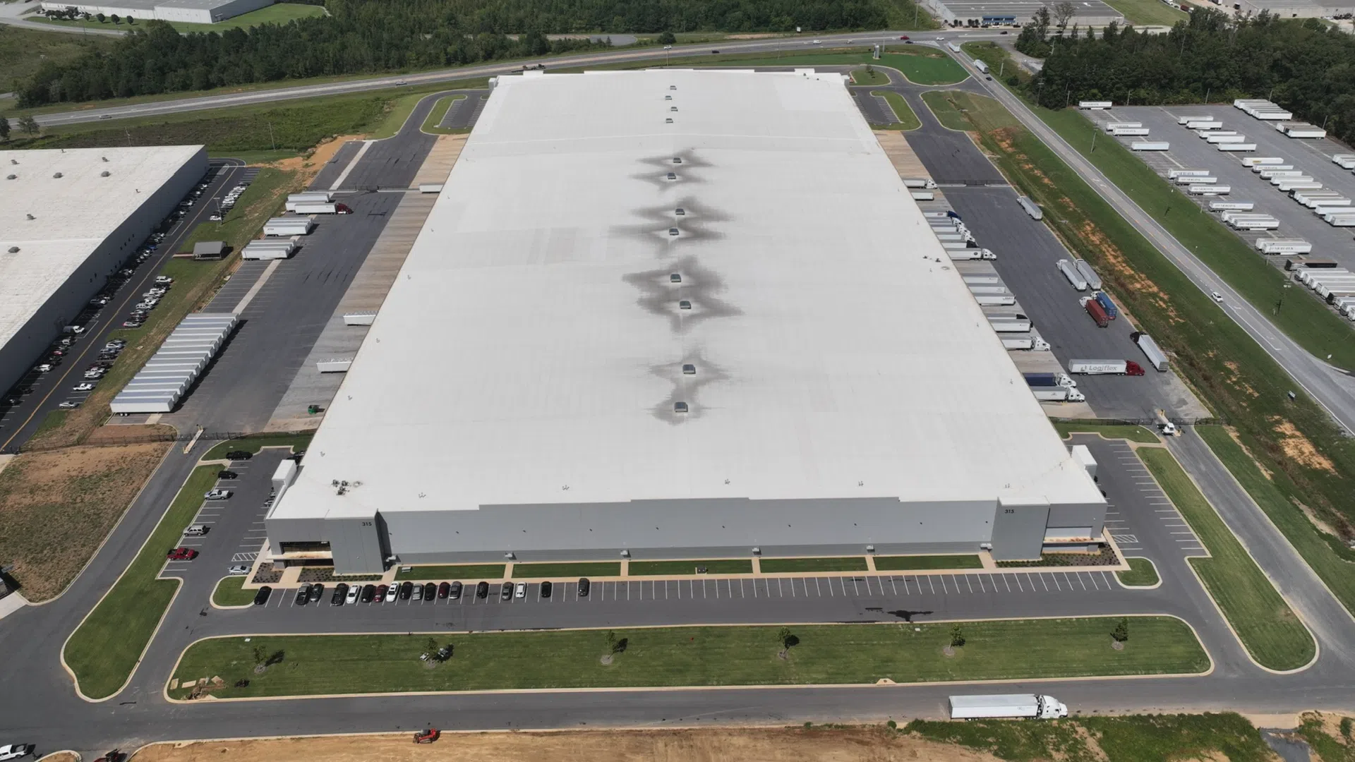 a large building with a parking lot