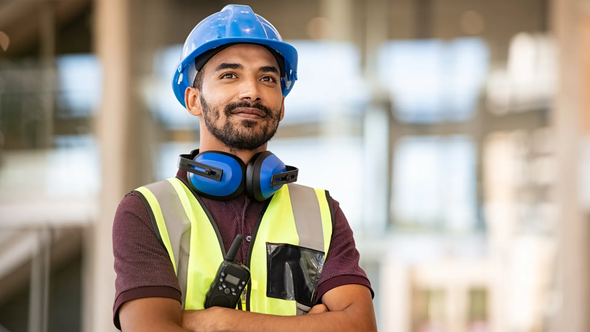 a man wearing a hard hat and safety vest