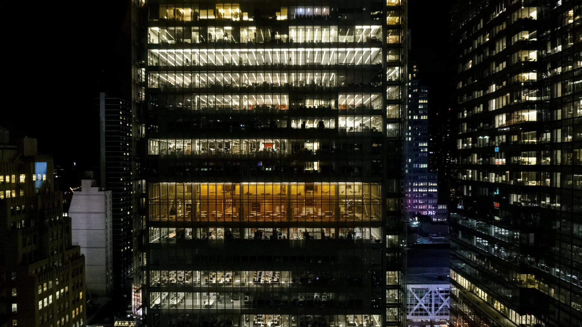 Laptop on table displaying detailed analytic dashboard with charts and graphs reflecting data metrics.