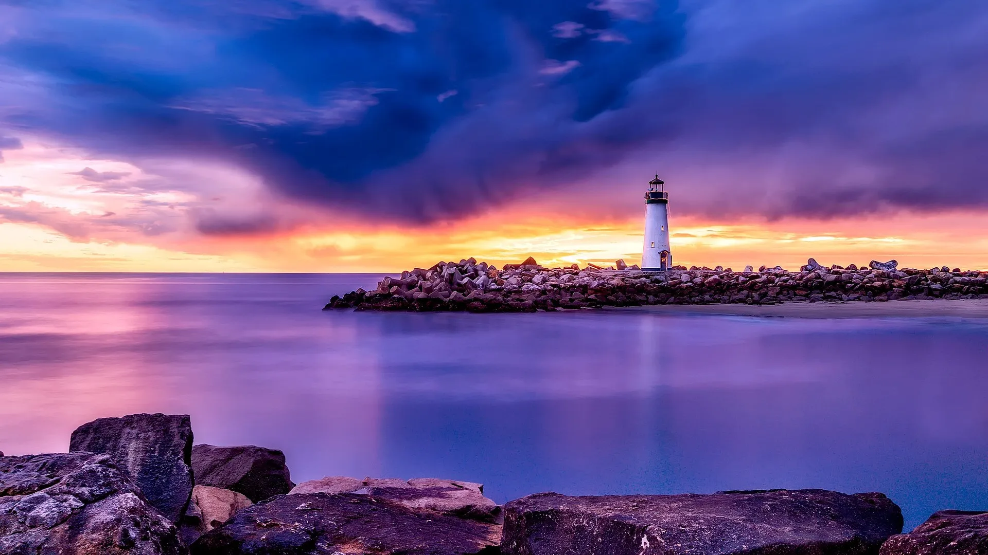 a lighthouse on a rocky island