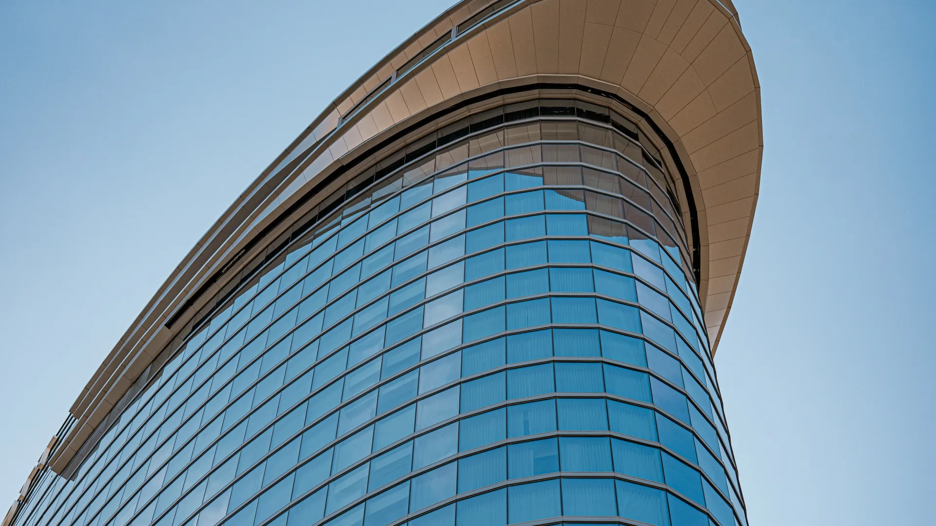 a tall building with a blue sky