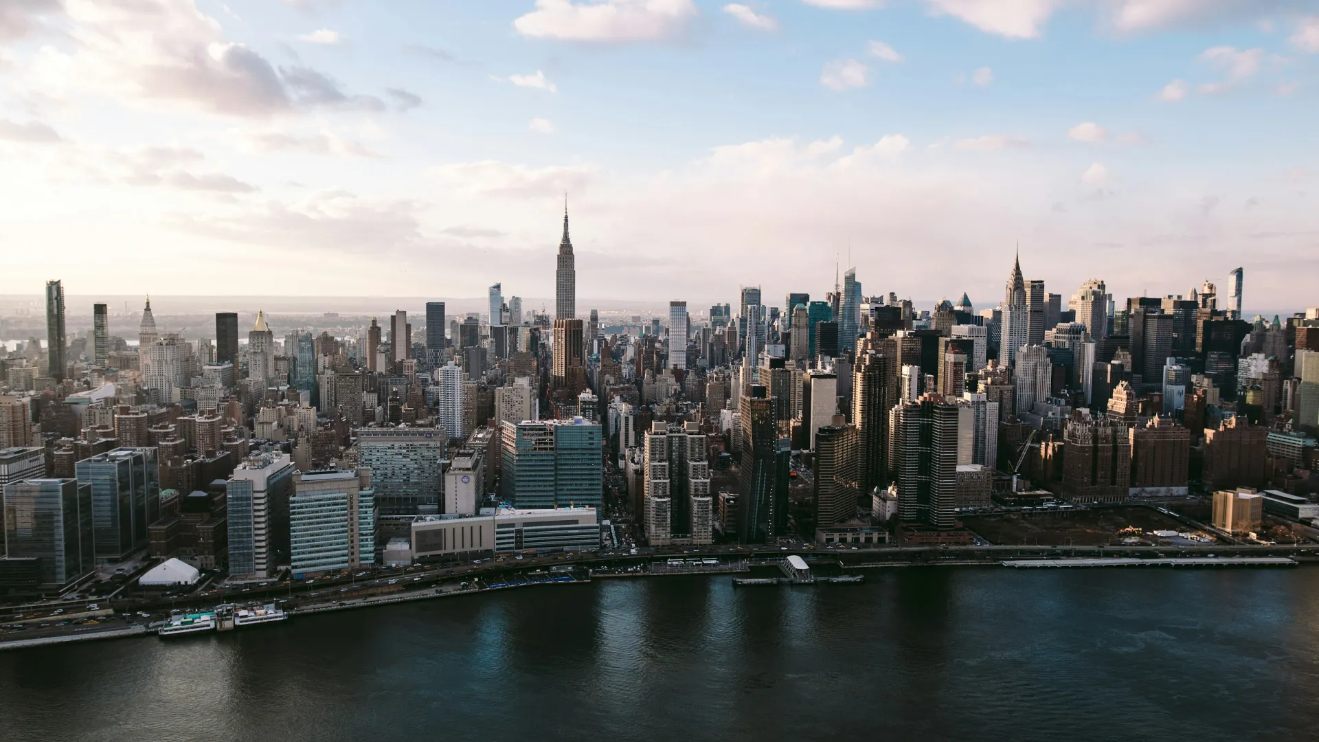 a city skyline with a river