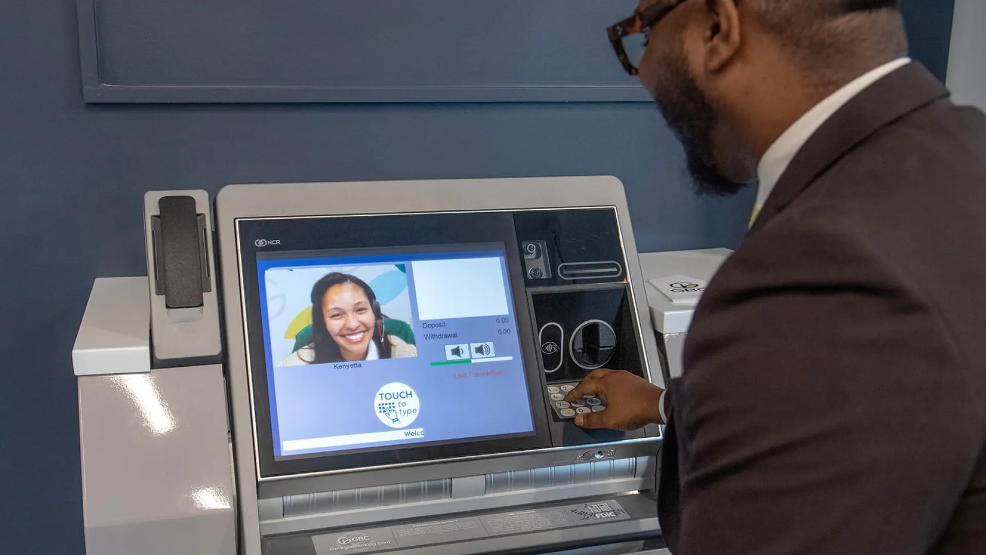 a man looking at a computer screen