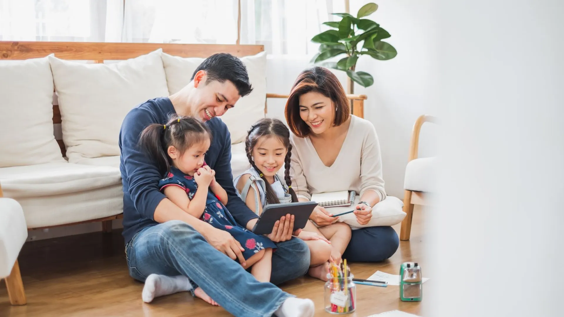 a family sitting on the floor