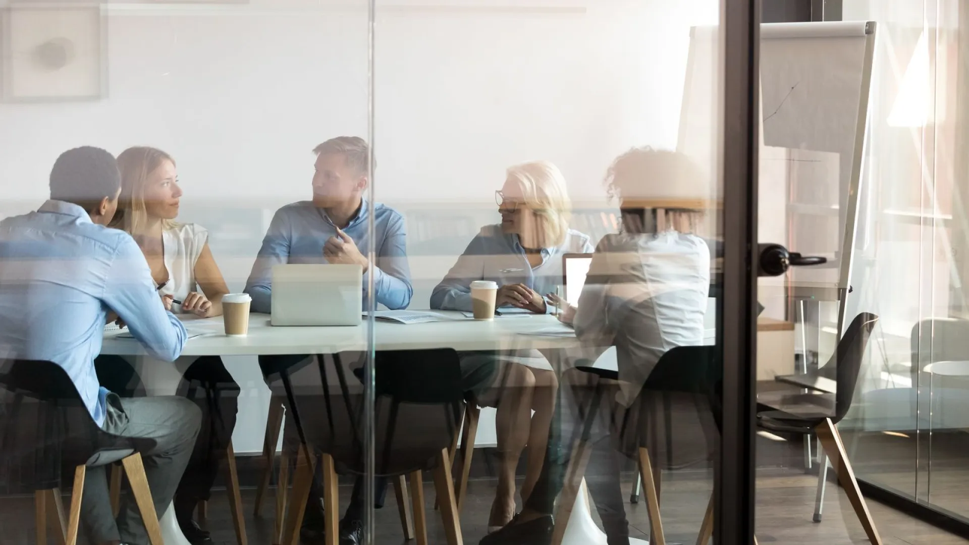 a group of people sitting around a table