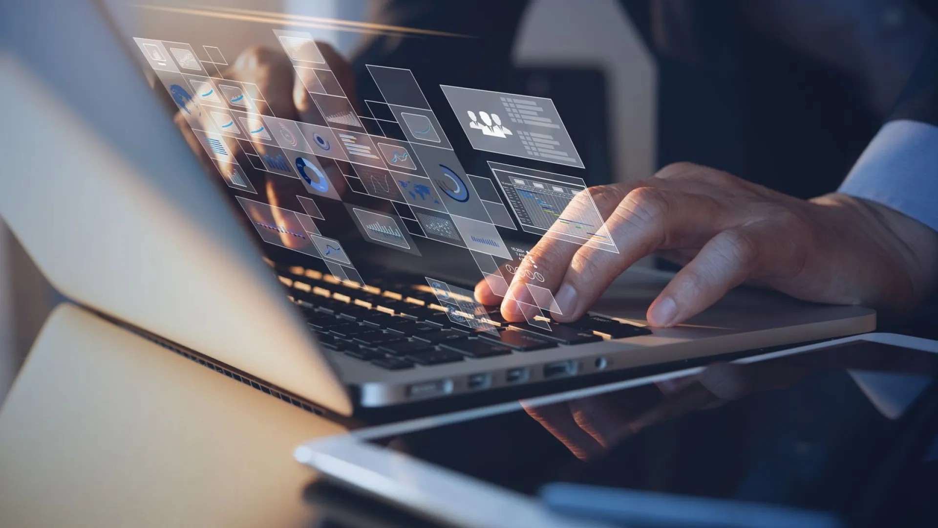 close-up of a person typing on a laptop