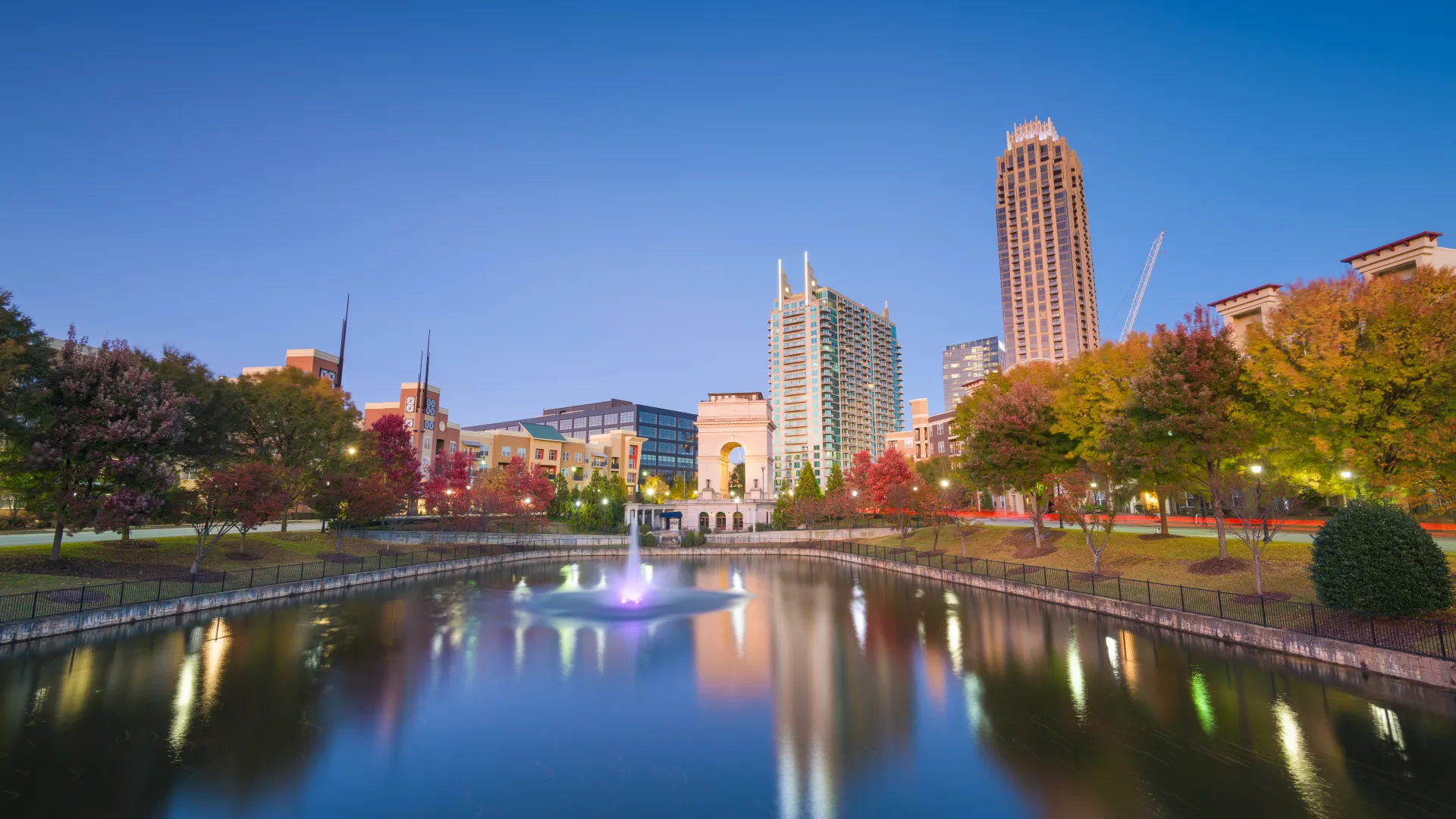 a body of water with a city in the background