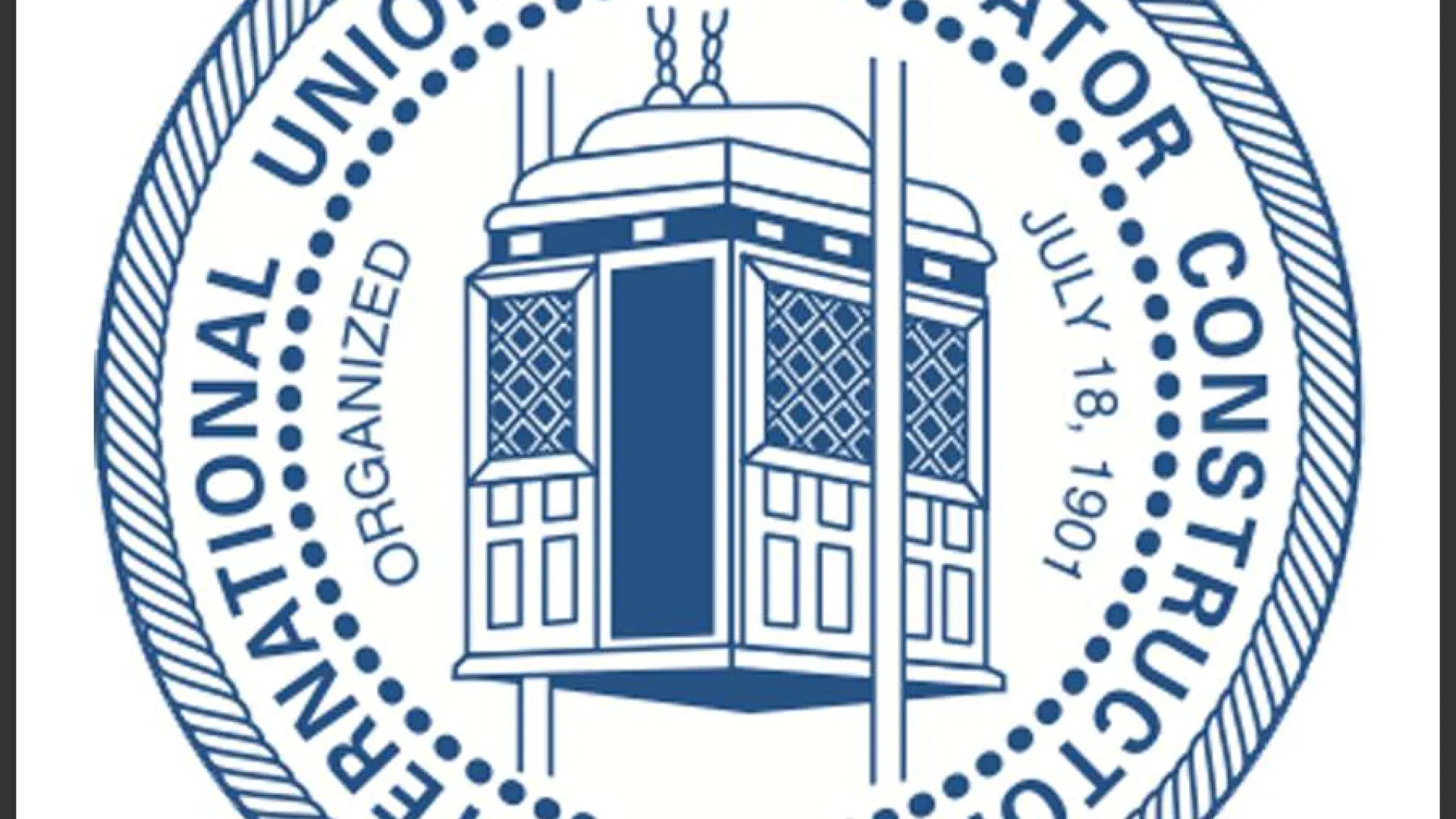 Emblem of the United Brotherhood of Carpenters and Joiners of America with tools and Latin motto Labor Omnia Vincit.