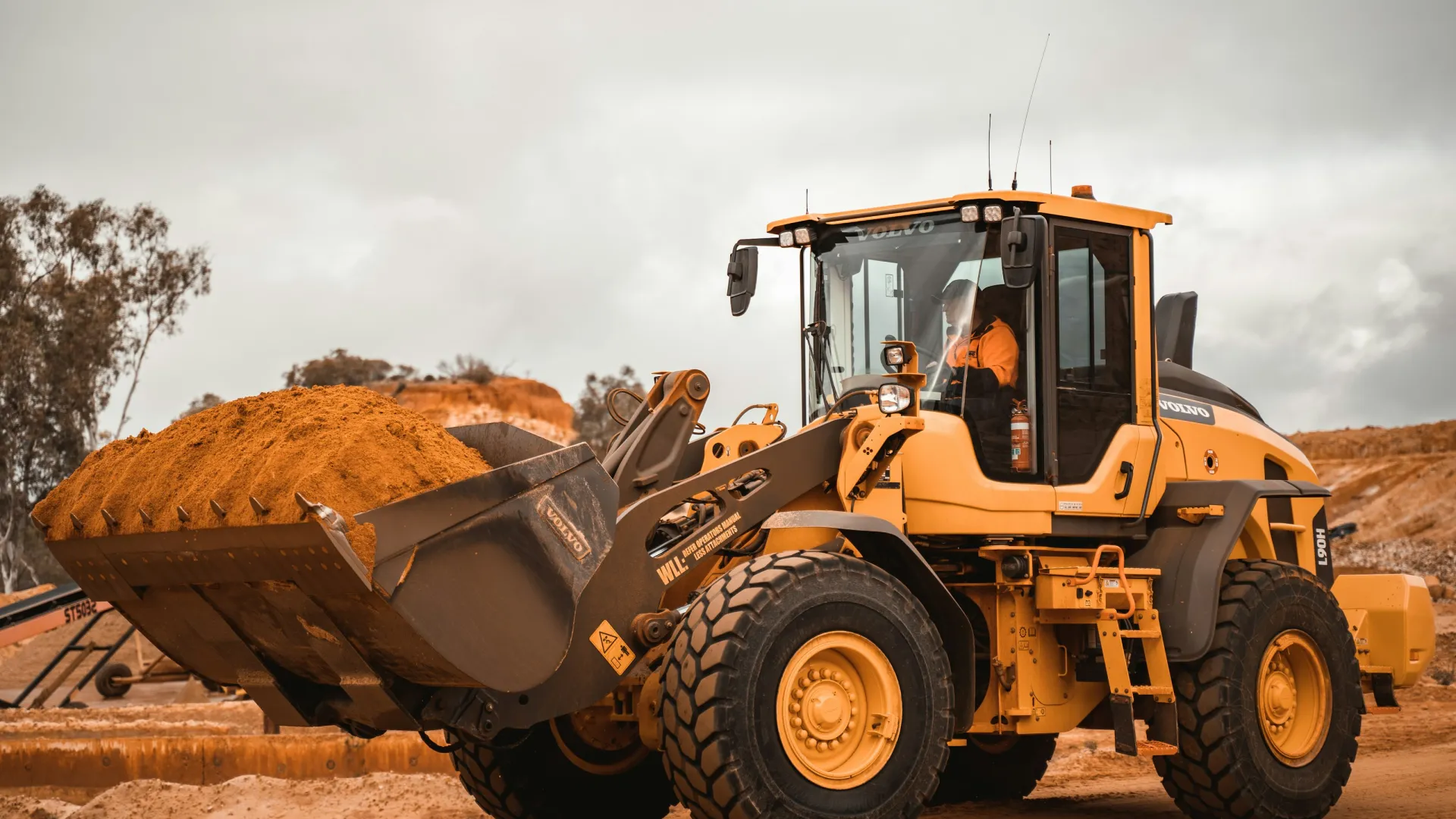 a tractor carrying a load