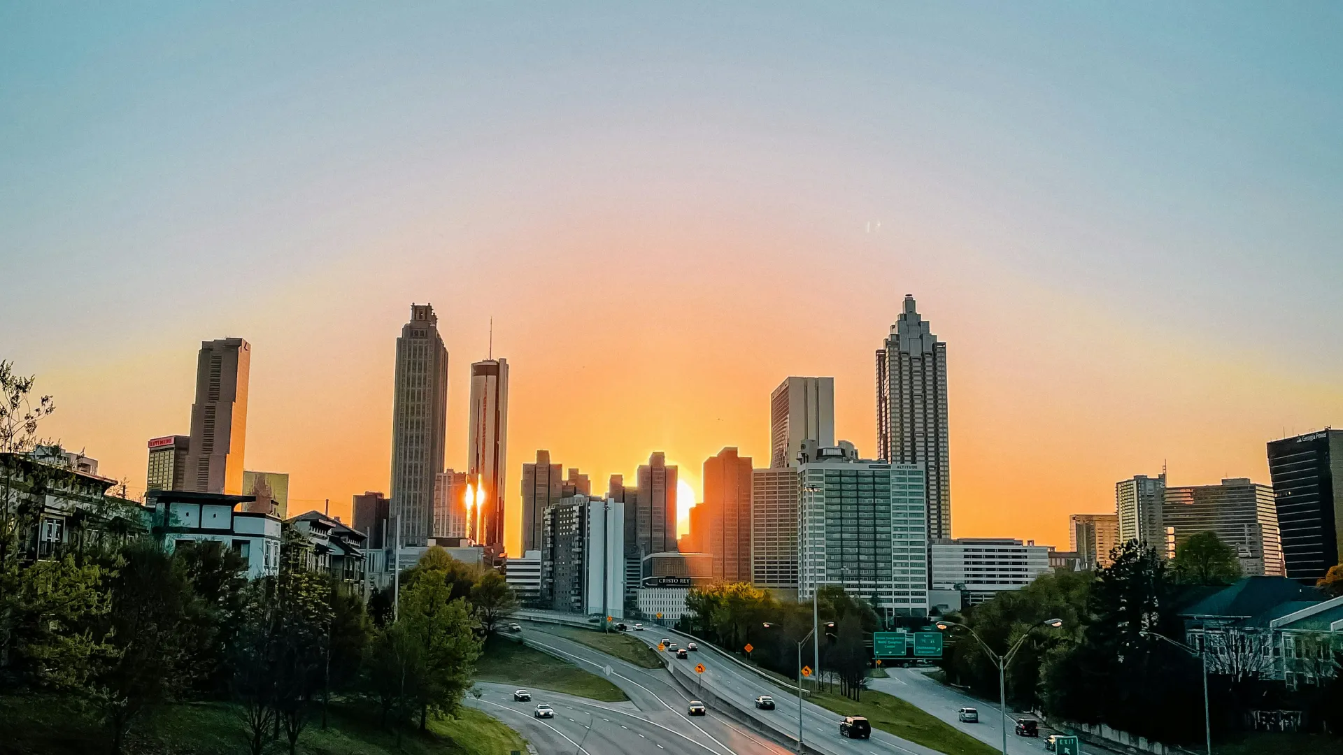 a city skyline with a freeway and cars