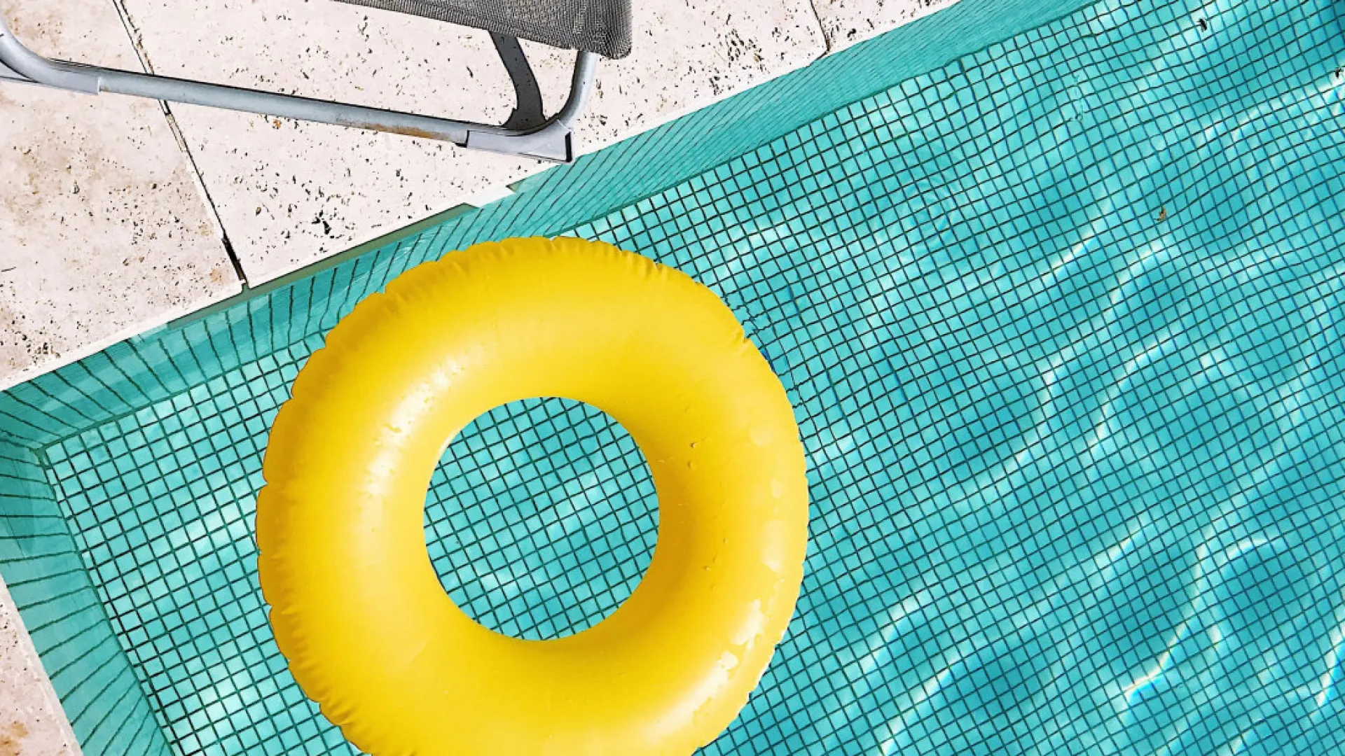 a yellow rubber ball on a mat