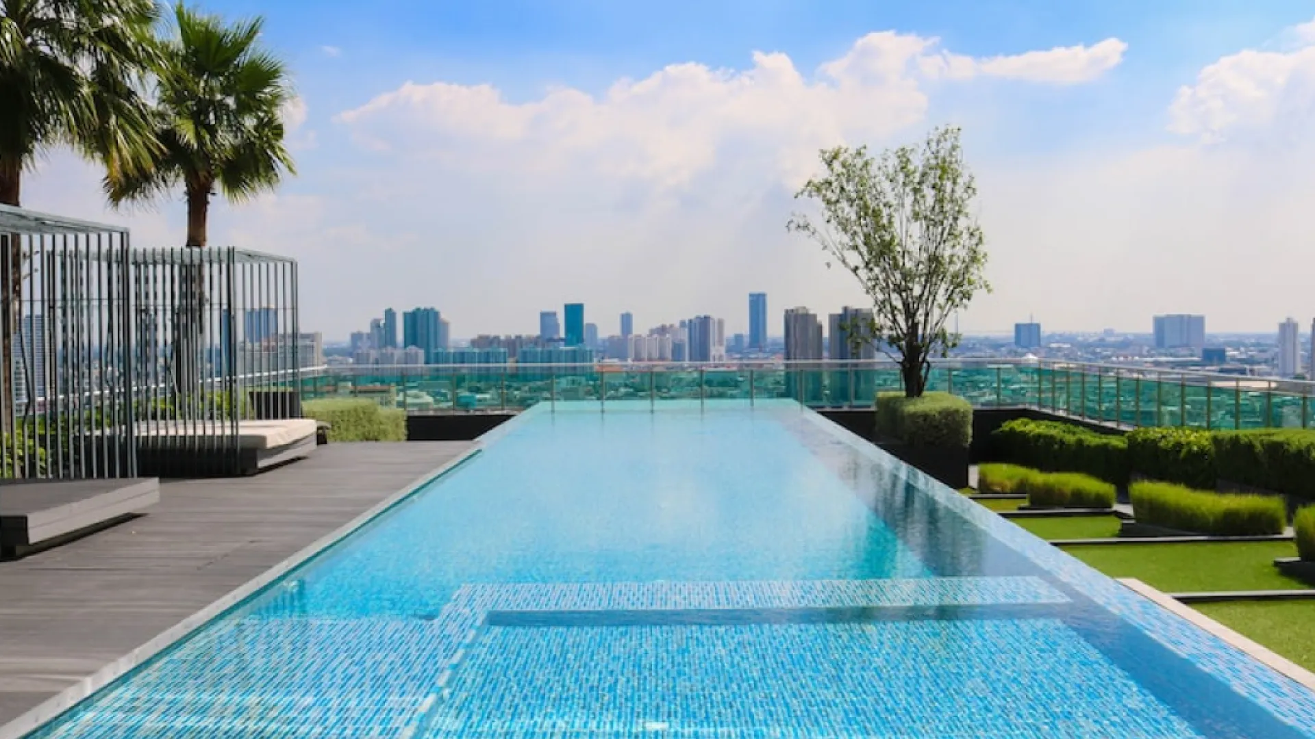 a pool with a city in the background