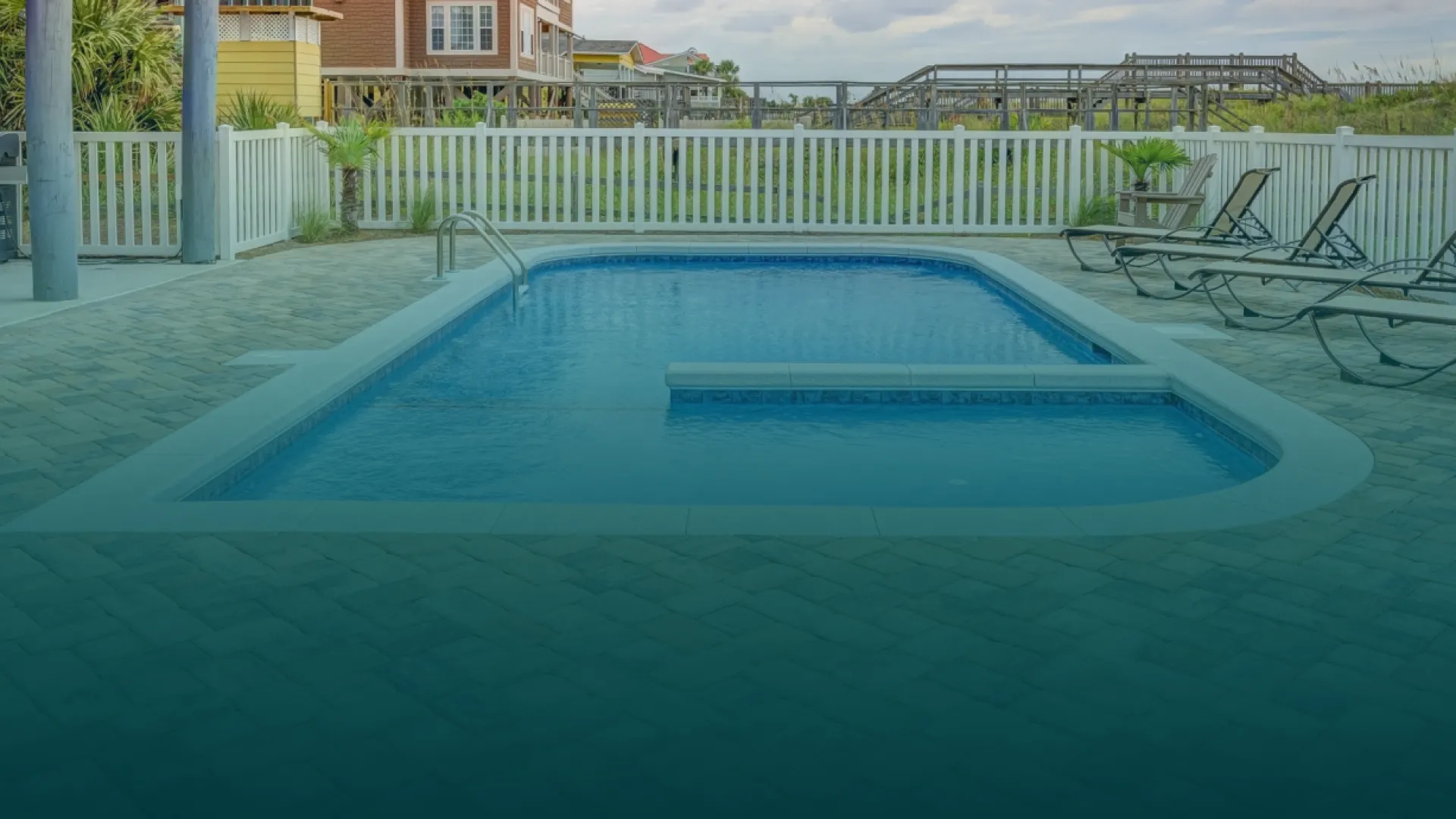 a swimming pool with a bench