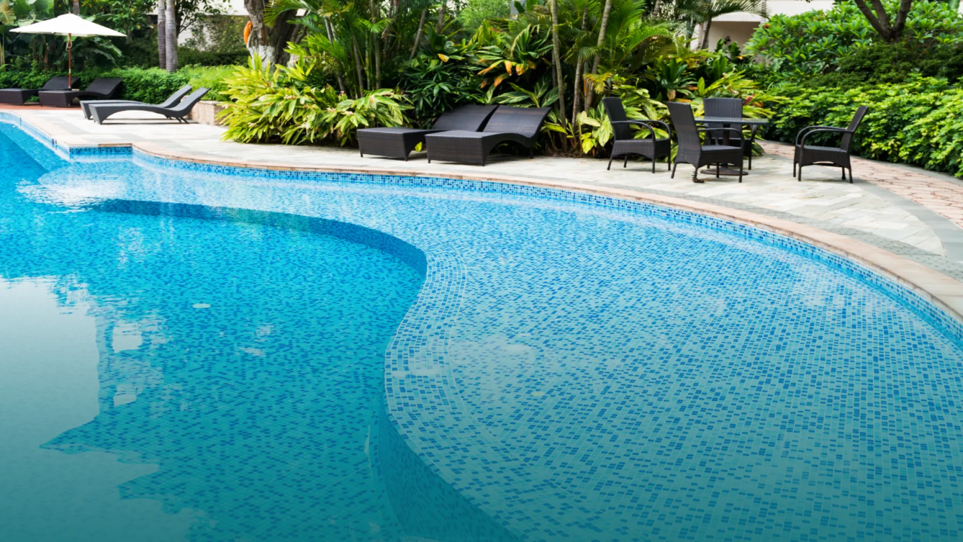 a pool with chairs around it