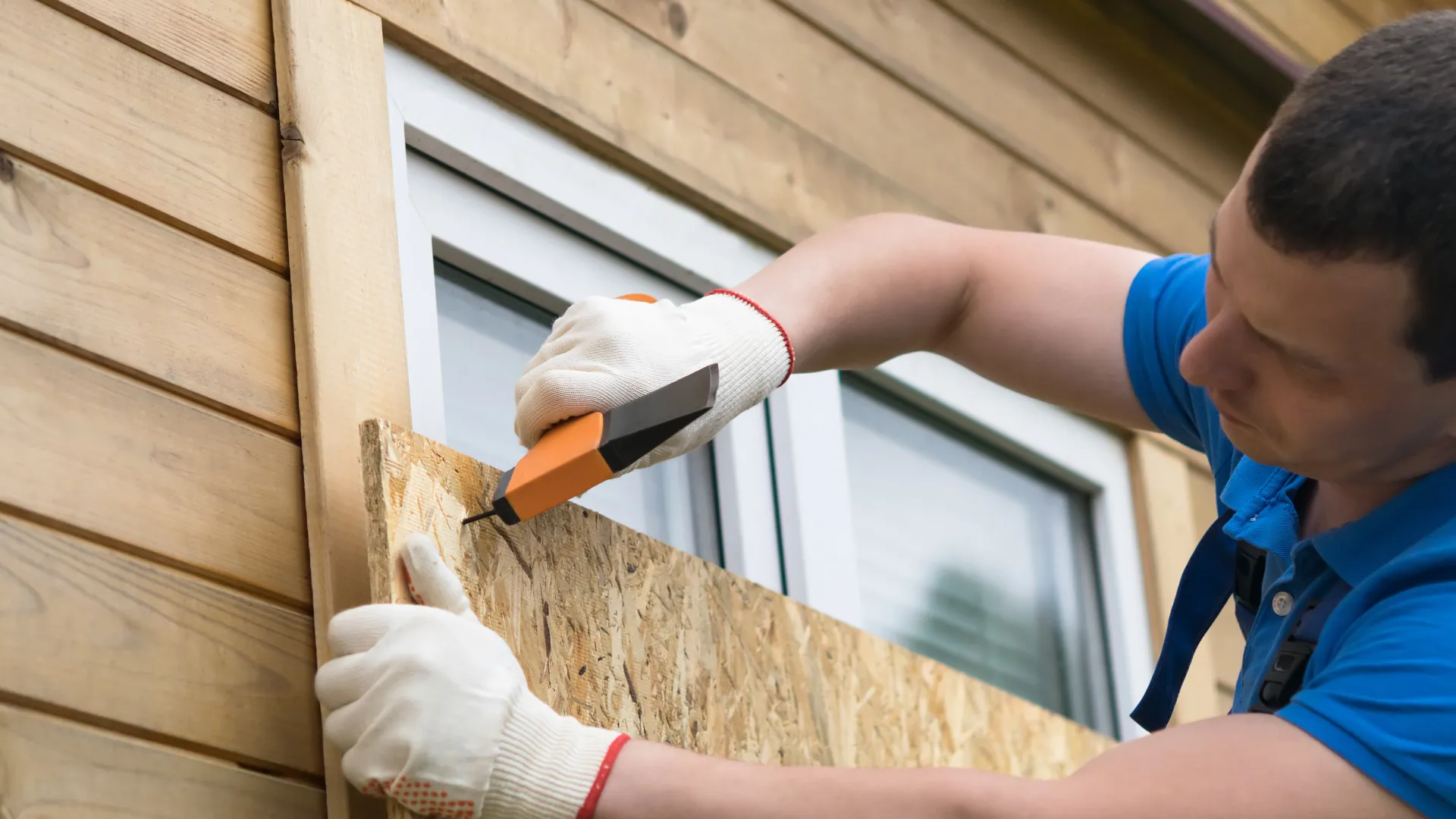 a man holding a drill