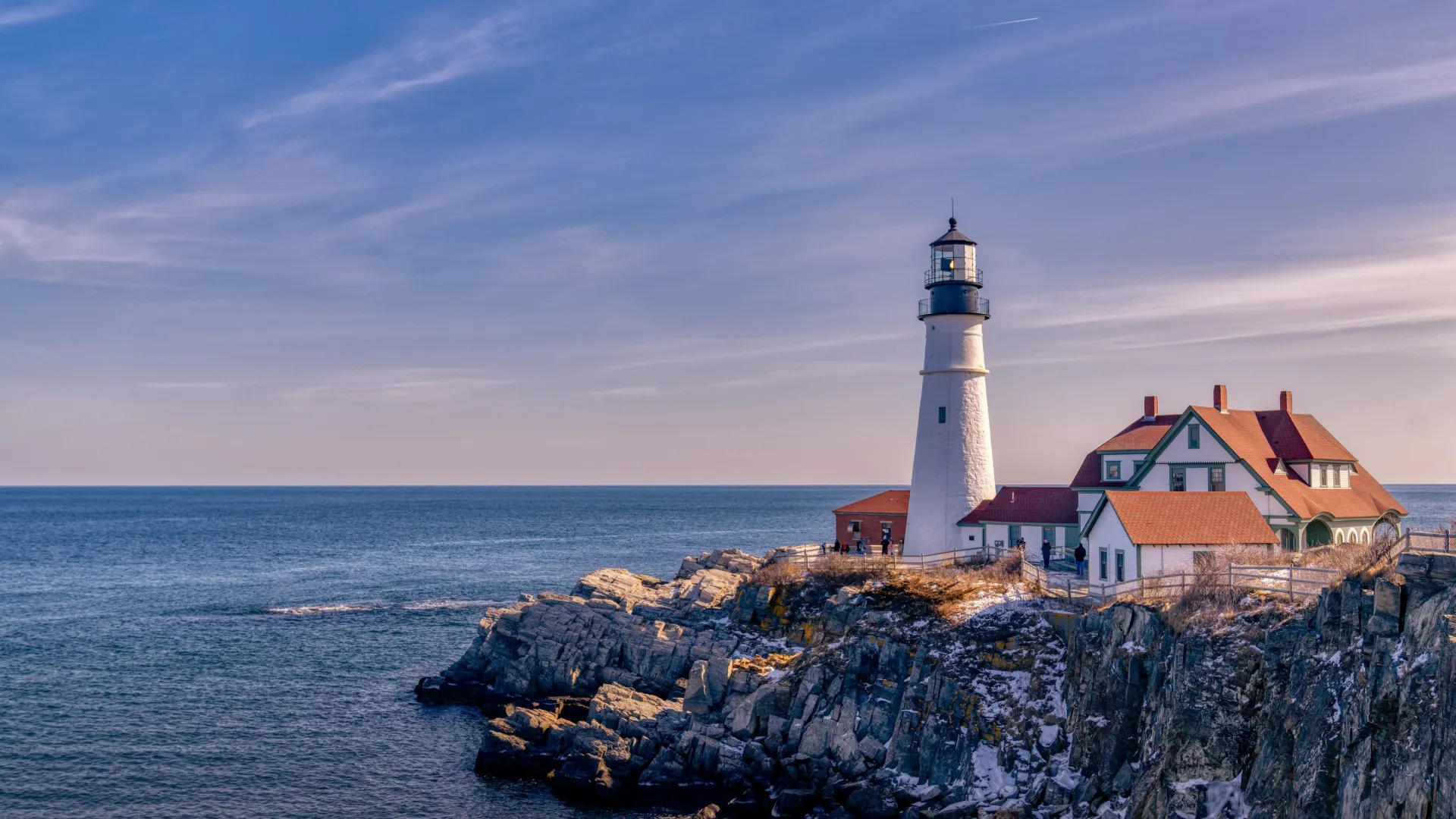 a lighthouse on a rocky island