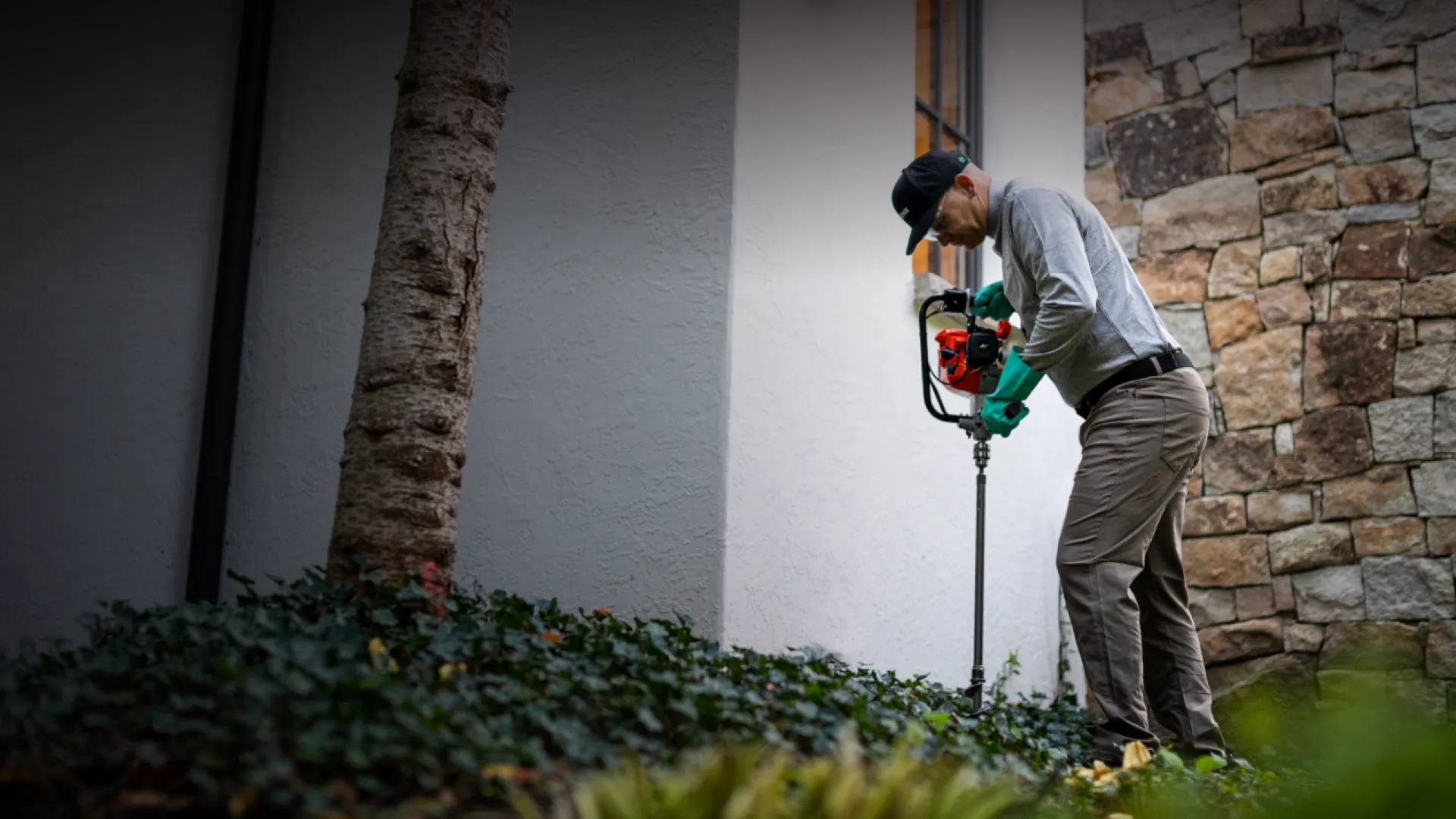 Pest Technician treating the shrubs