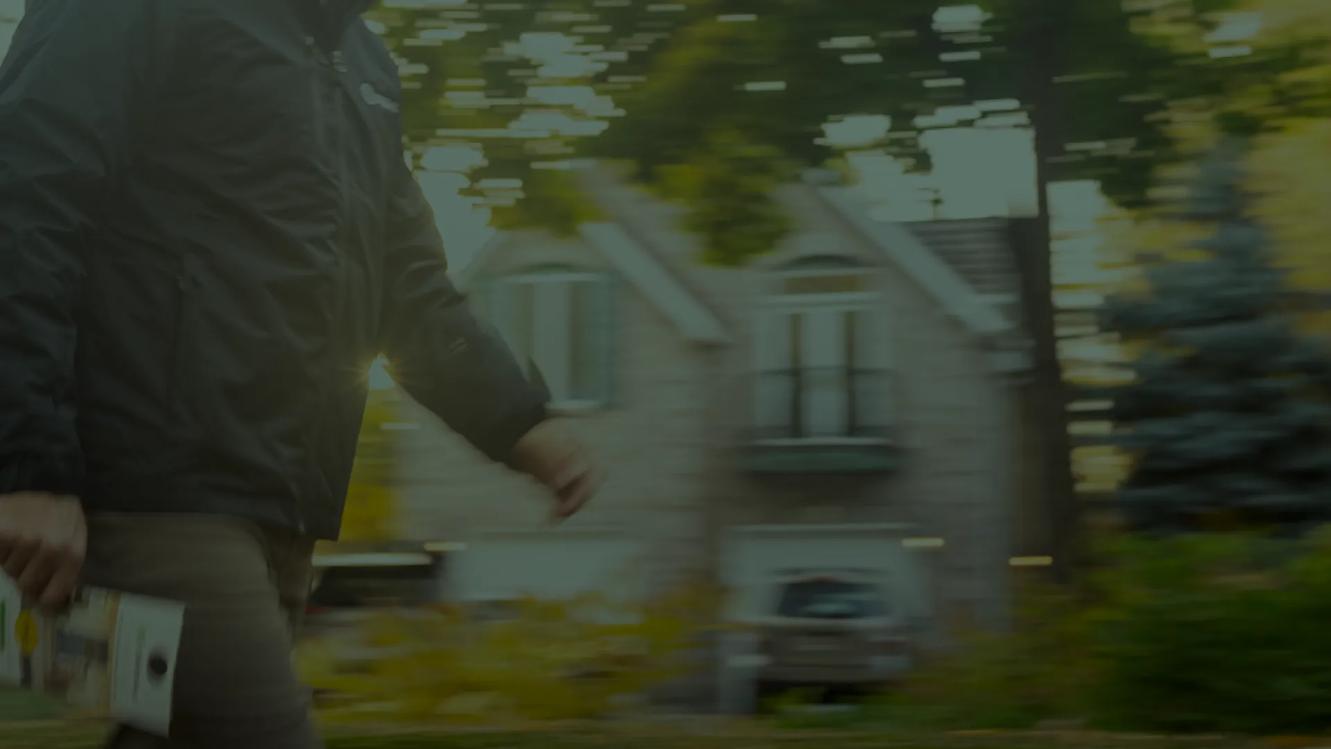 Pest Technician walking past house