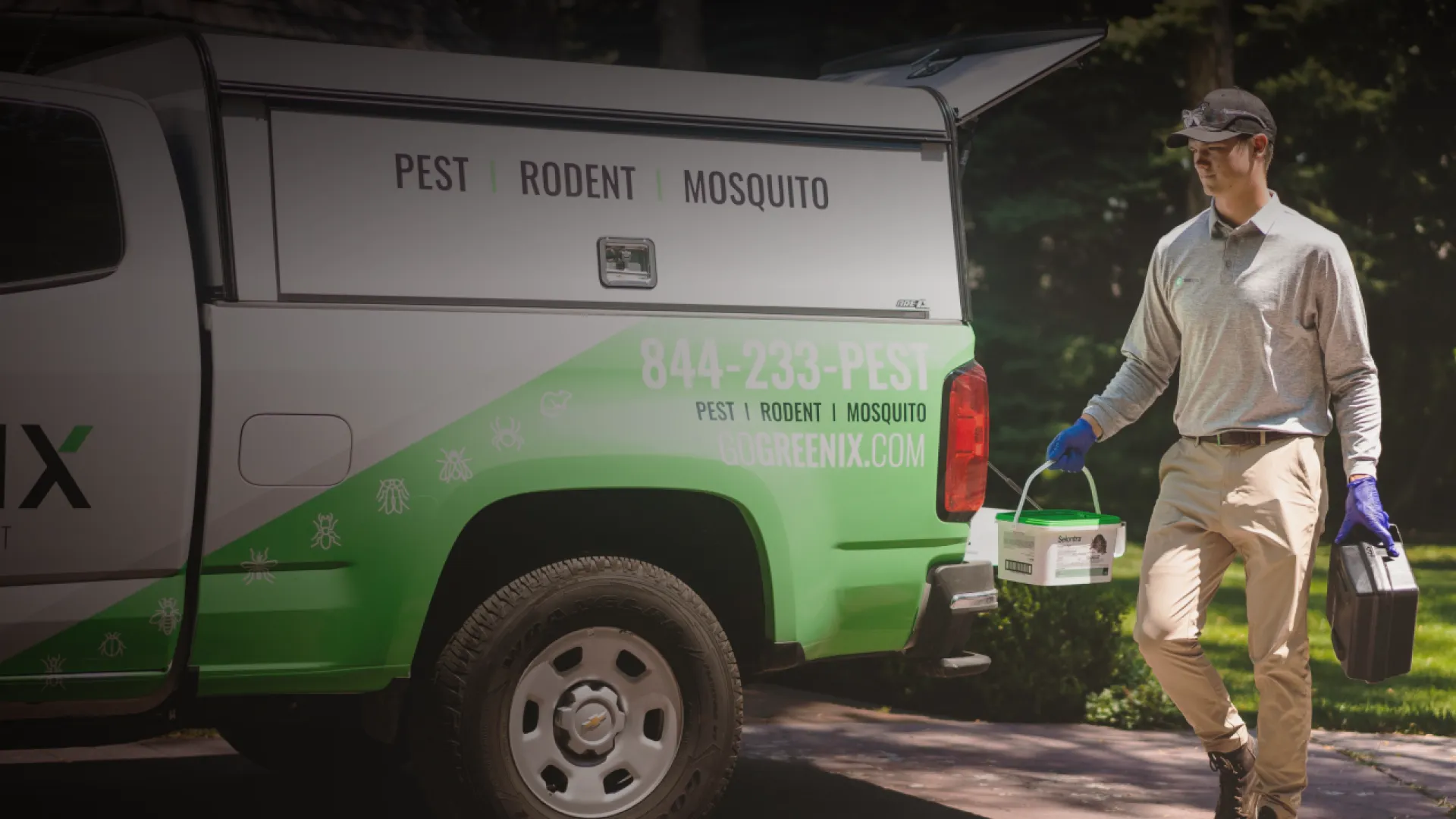 Pest Technician putting equipment into truck