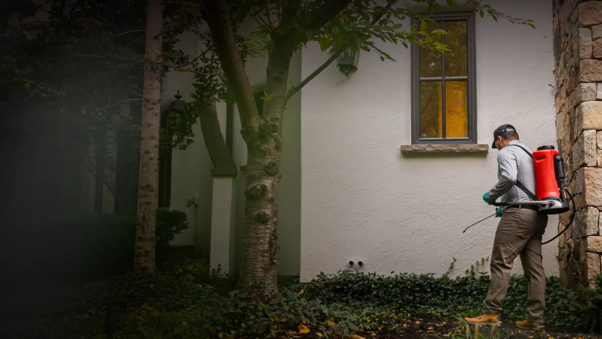 Pest Technician spraying for pests