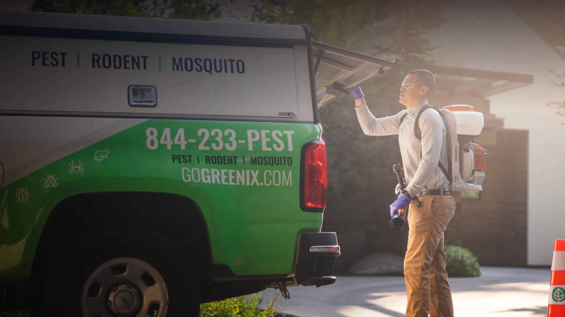 Pest Technician getting equipment from truck